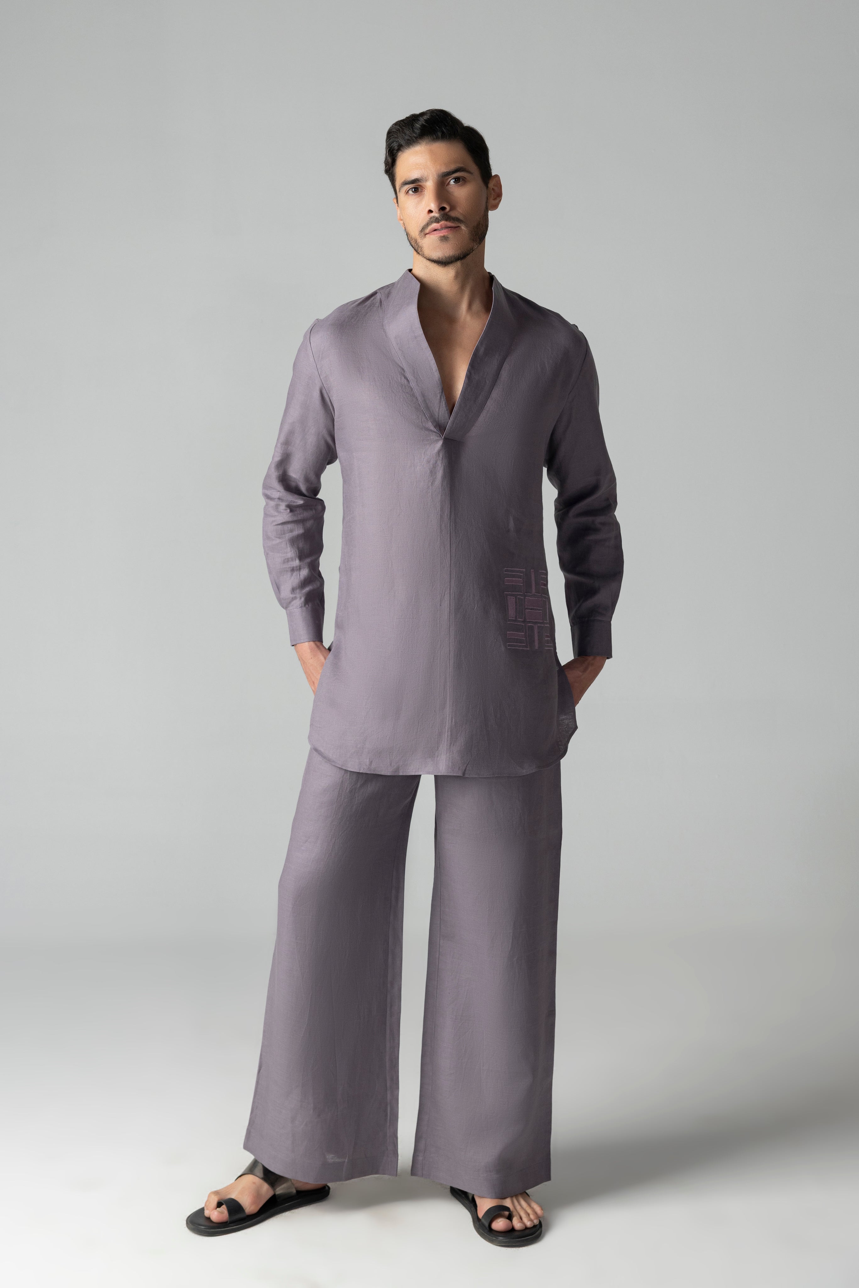 Mauve short linen kurta with thread embroidery detailing on the waist, paired with a matching plazzo