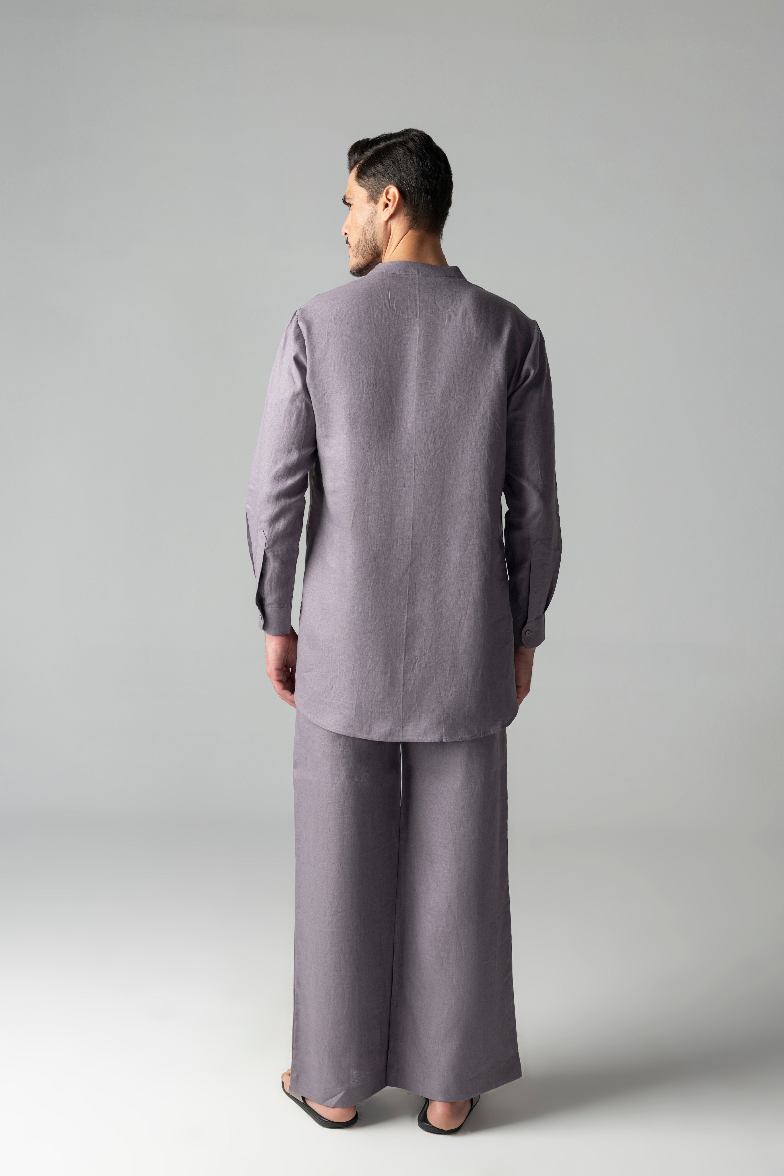 Mauve short linen kurta with thread embroidery detailing on the waist, paired with a matching plazzo