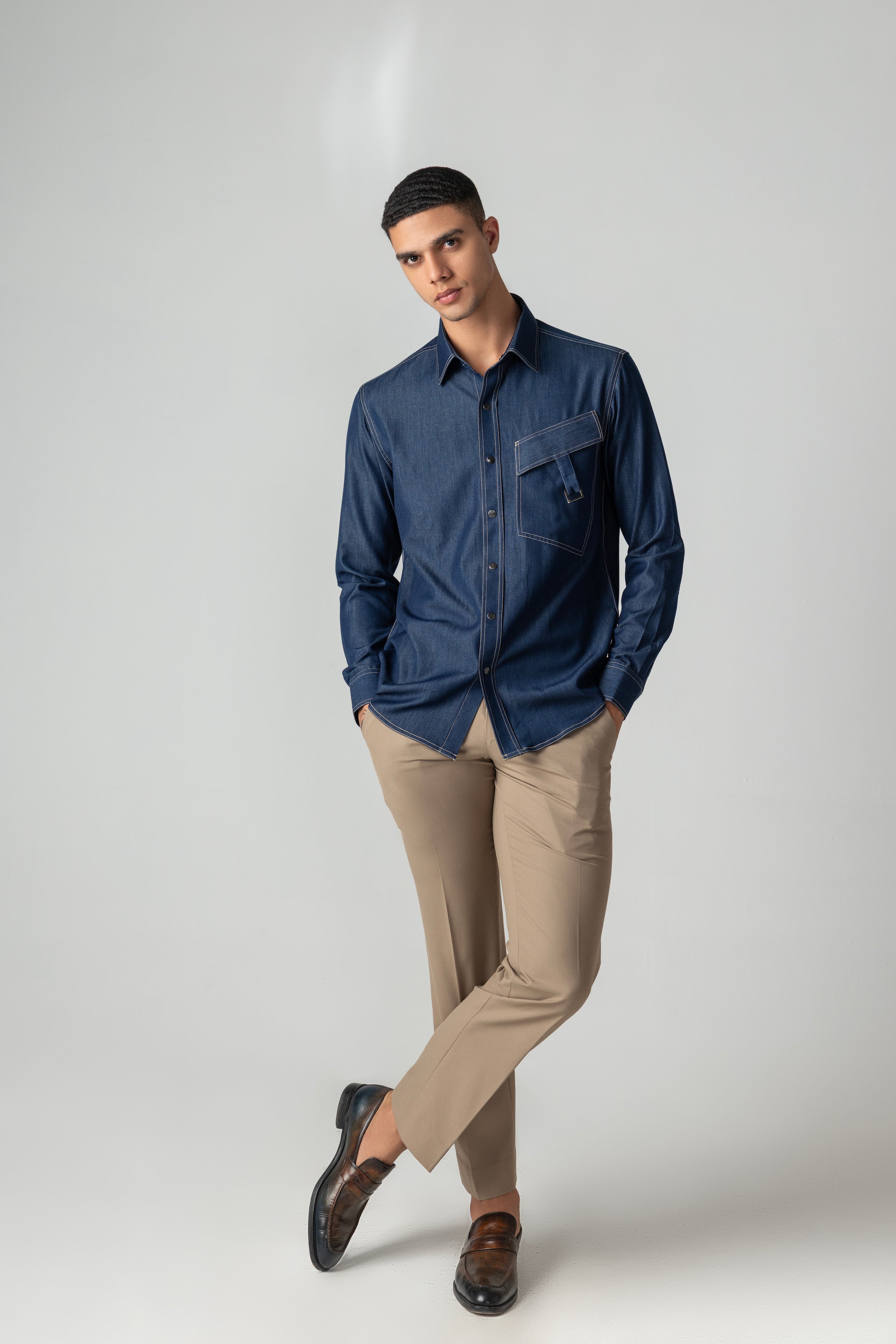 Dark denim shirt with patch pocket & buckle detailing.