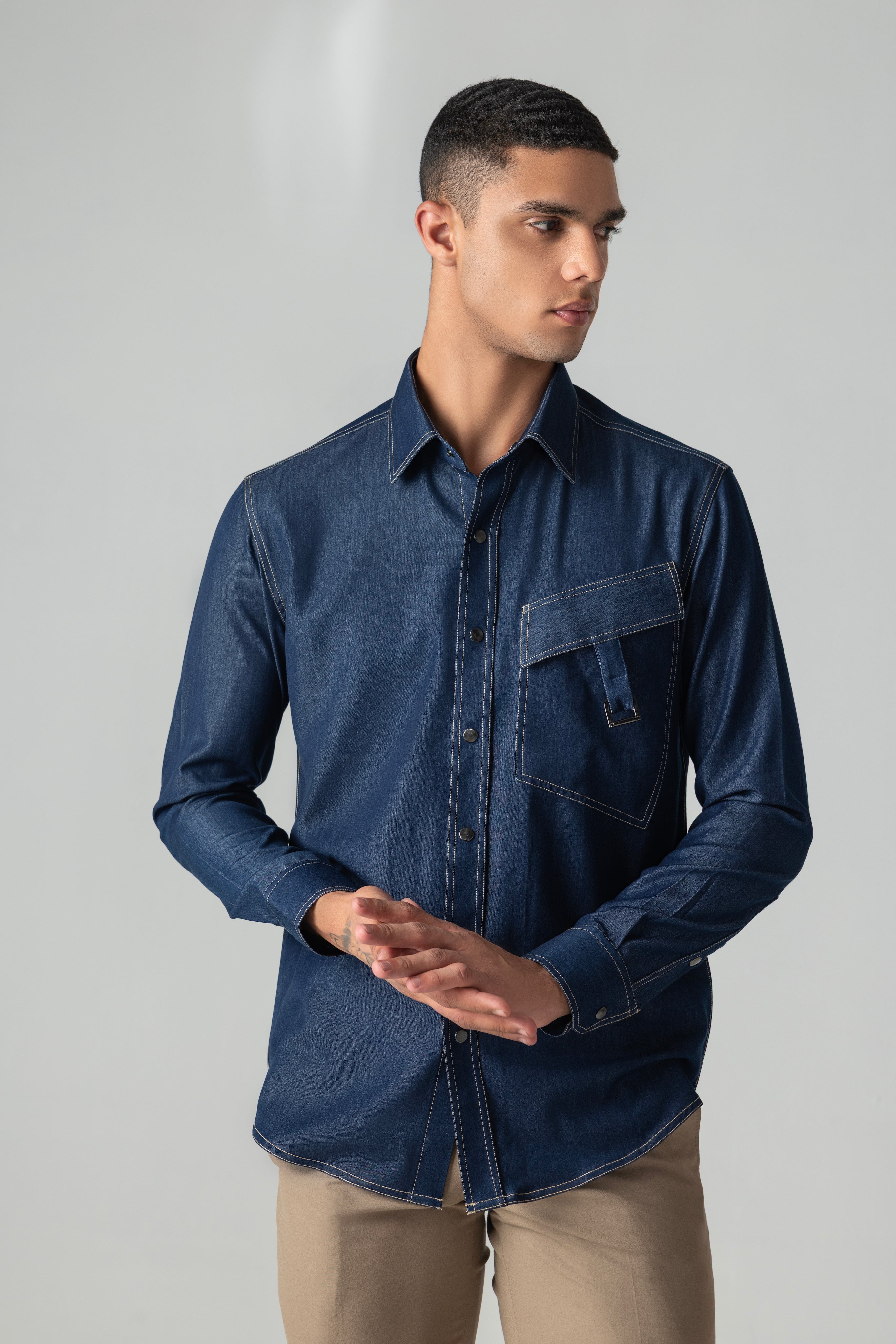 Dark denim shirt with patch pocket & buckle detailing.