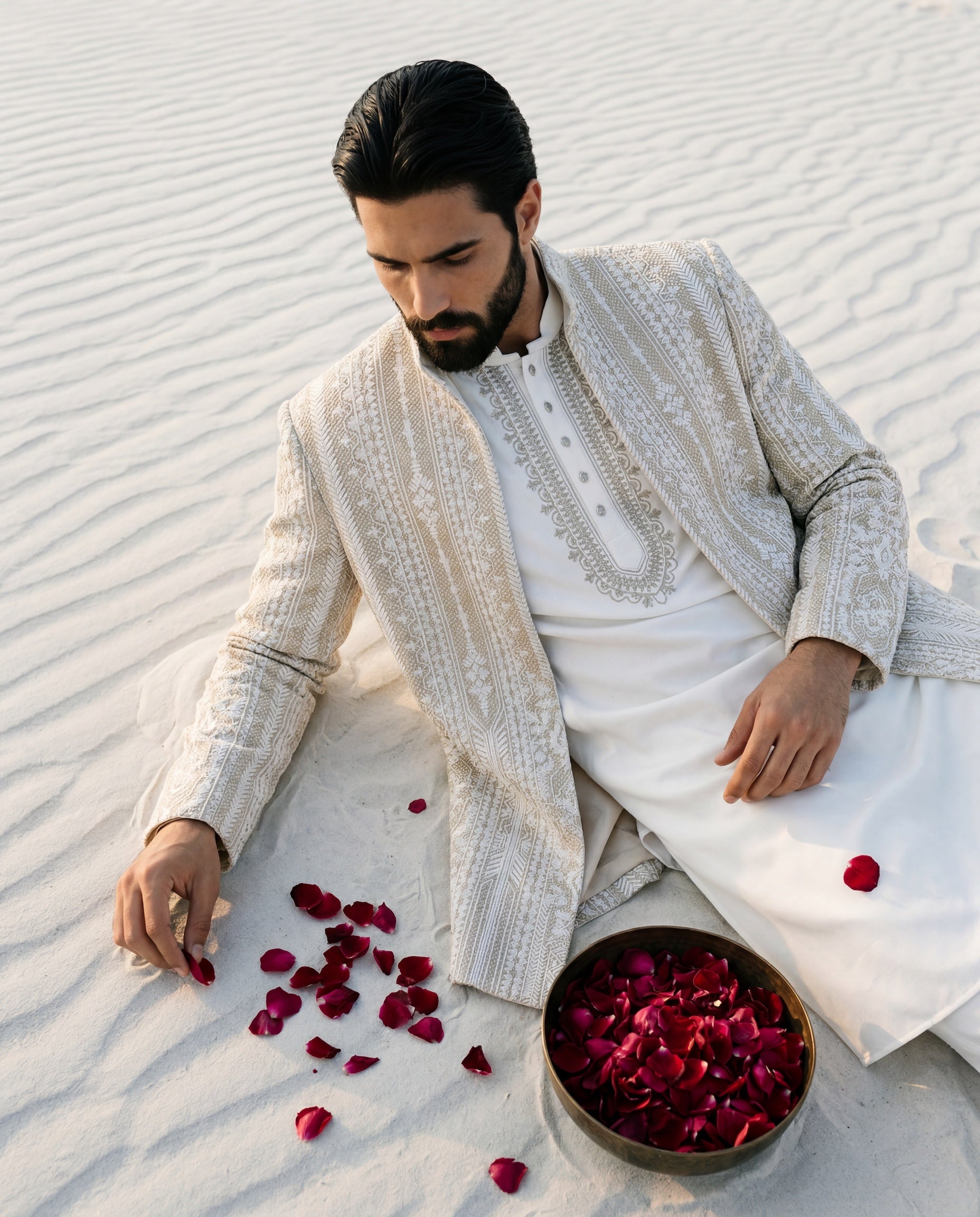 Textured rayon Indo-Western jacket with tonal embroidery detailing, paired with a knit kurta with embroidered neckline and matching pants.