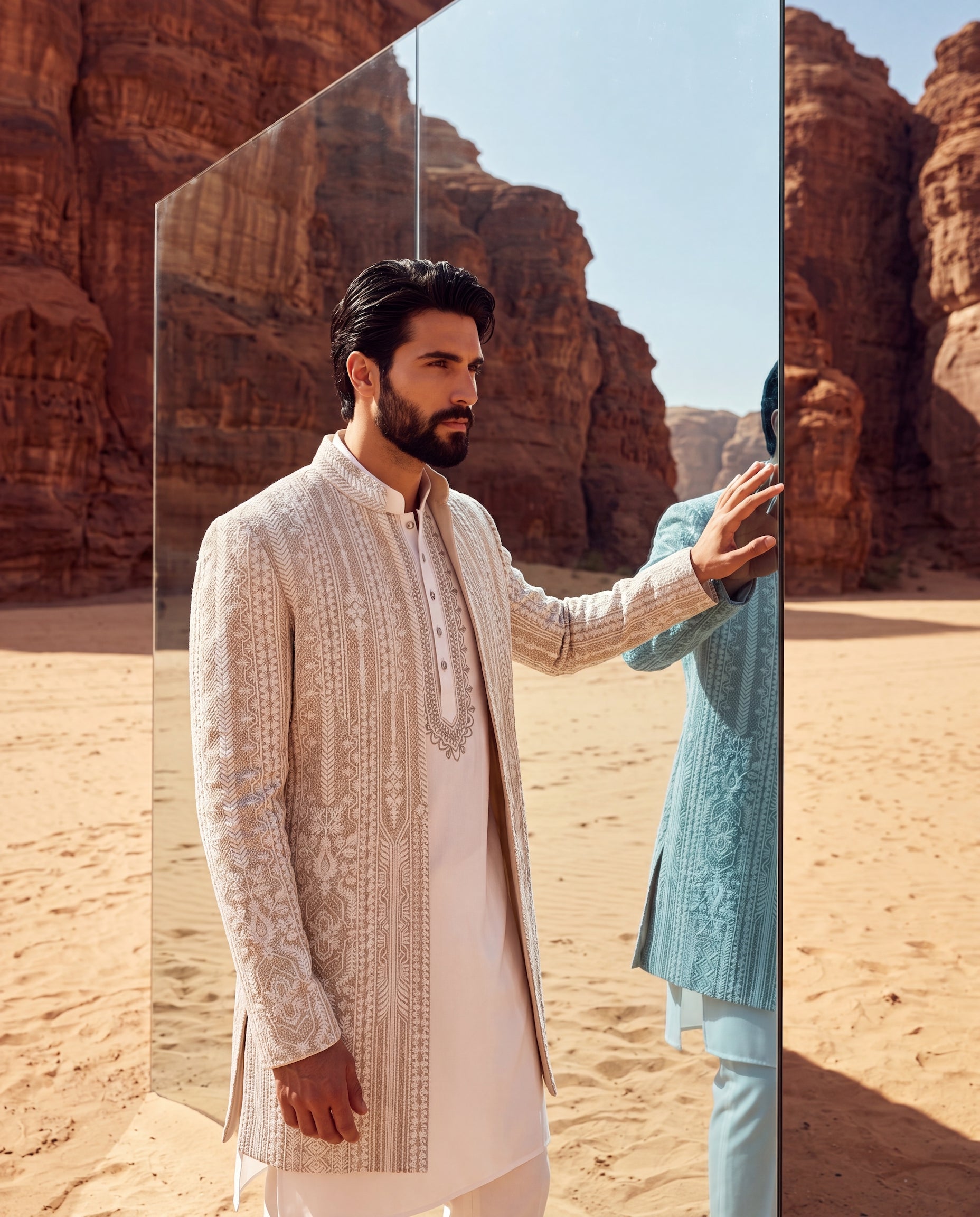 Textured rayon Indo-Western jacket with tonal embroidery detailing, paired with a knit kurta with embroidered neckline and matching pants.