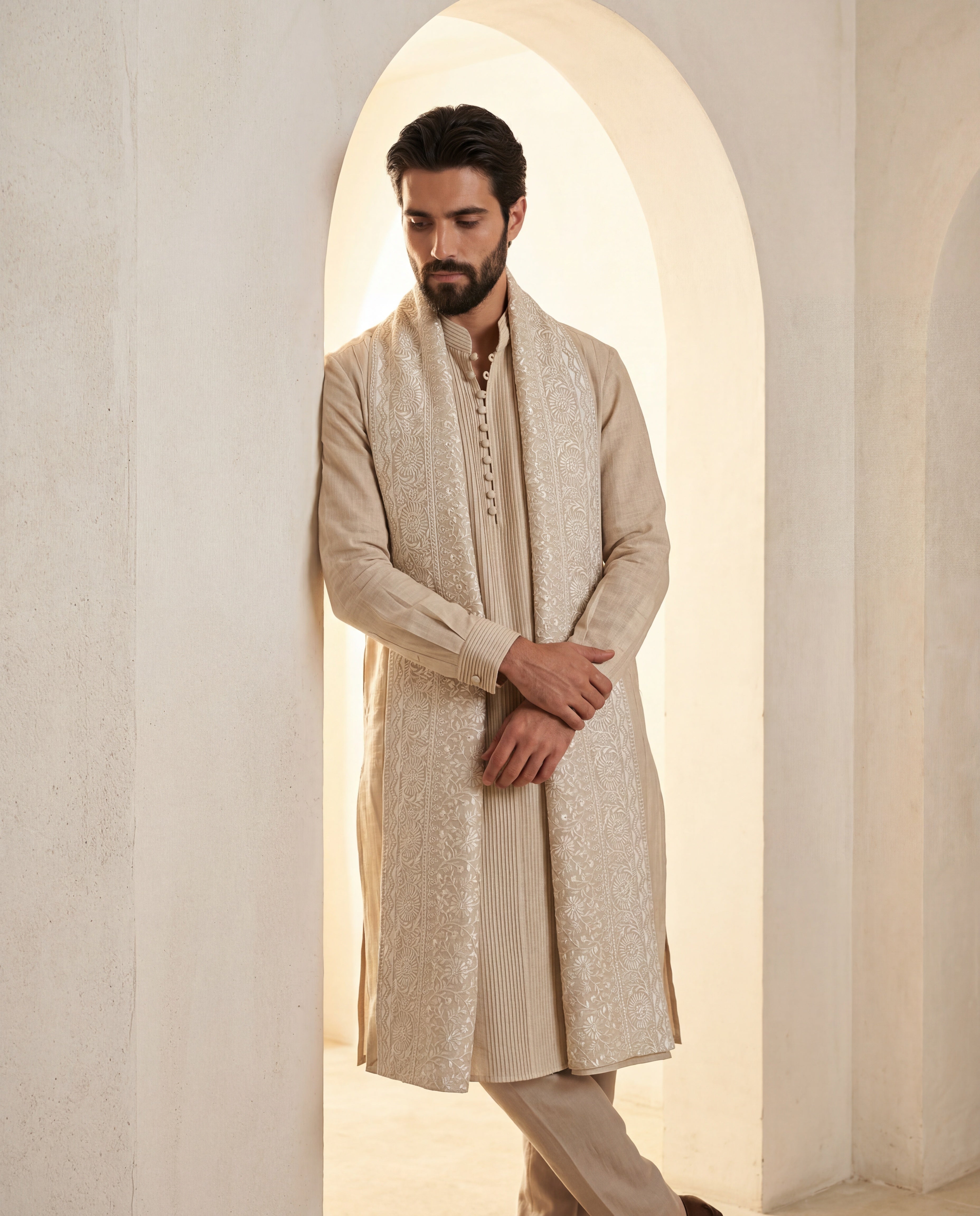 Linen kurta with pintucks detailing, paired with matching linen aligadhi andan embroidered stole.