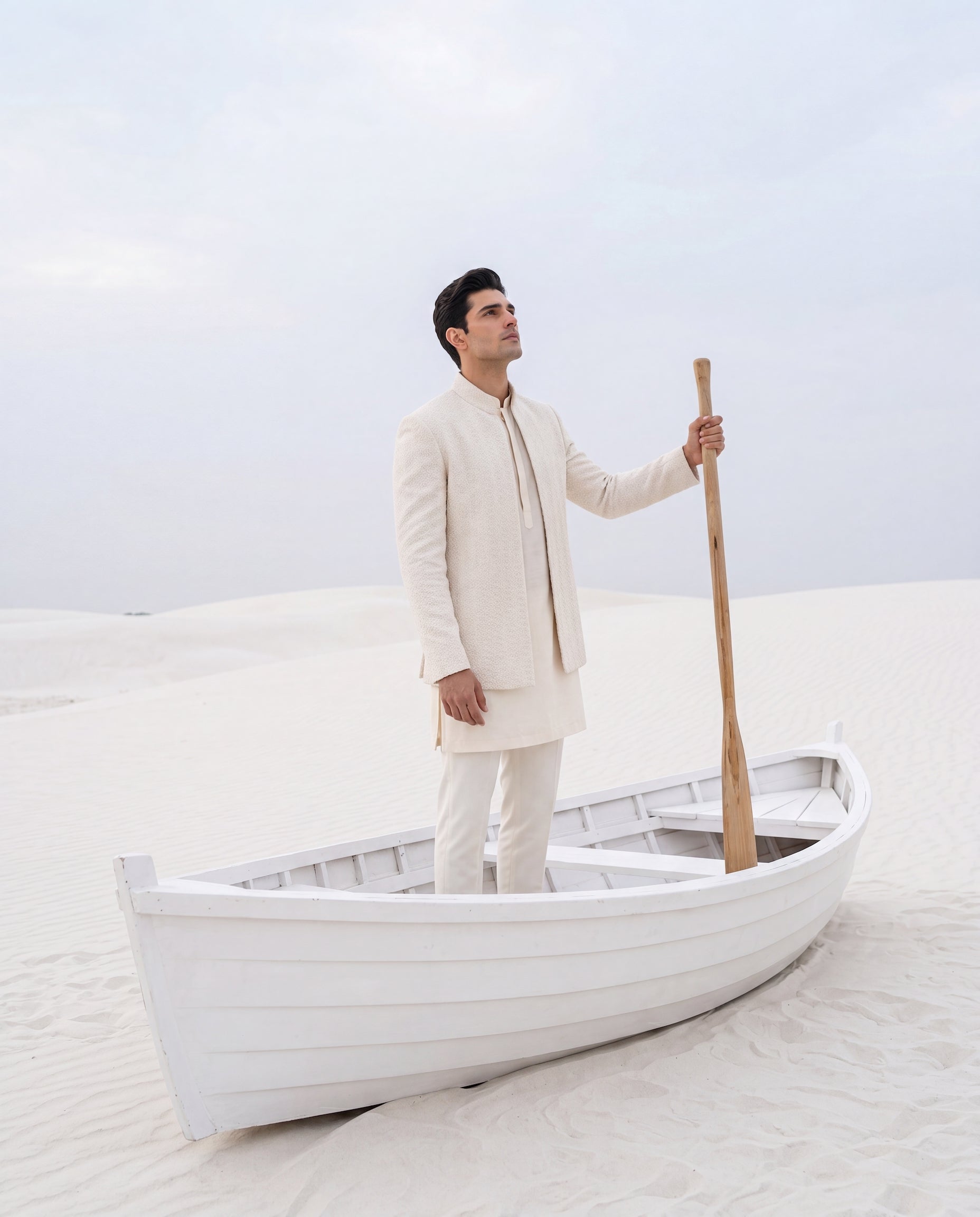 Crochet Indo-Western jacket with embroidery detailing, paired with a matching crochet kurta and knit pants.
