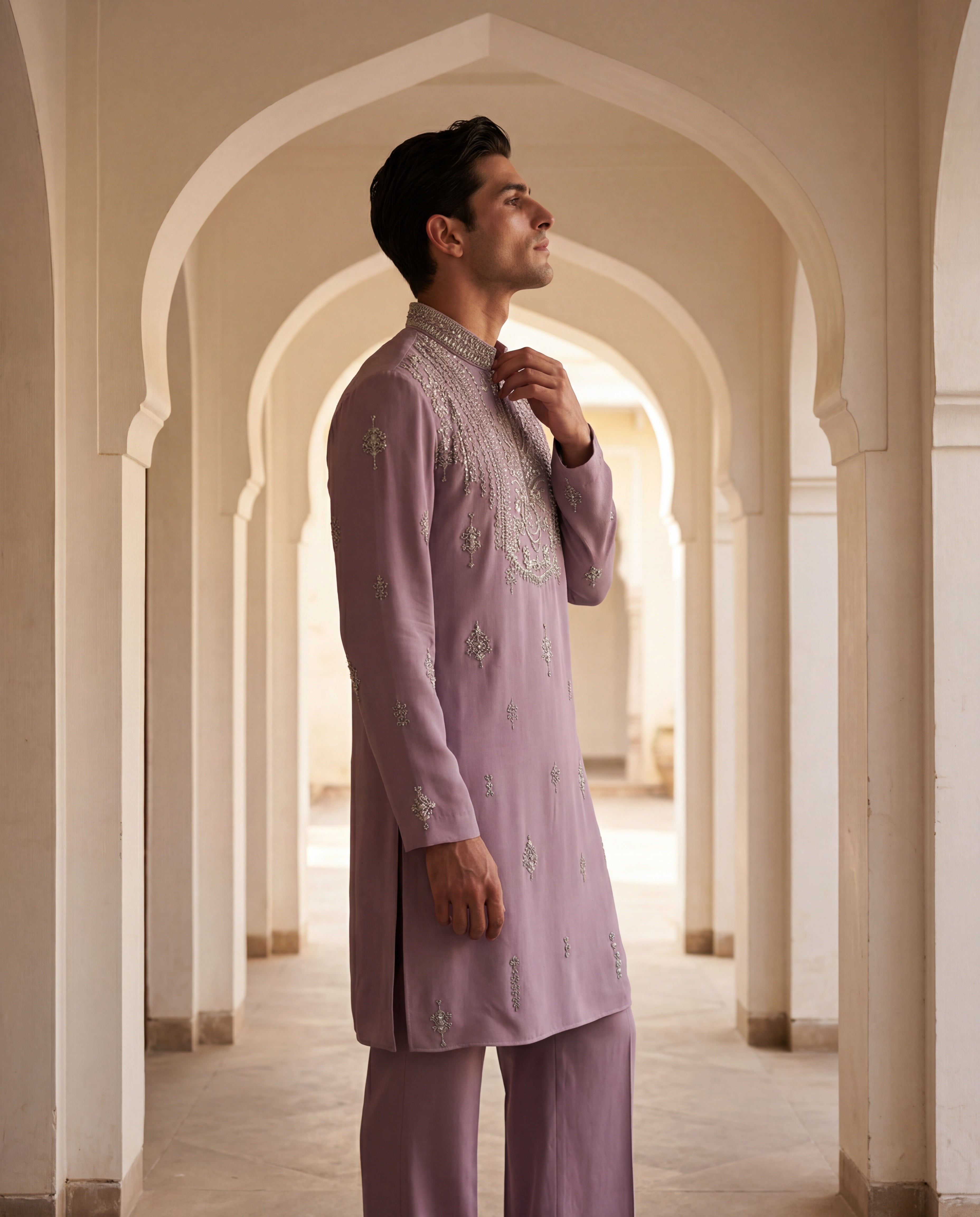 Mauve knit kurta with intricate silver hand embroidery at the neckline and scattered motifs, paired with matching palazzo.