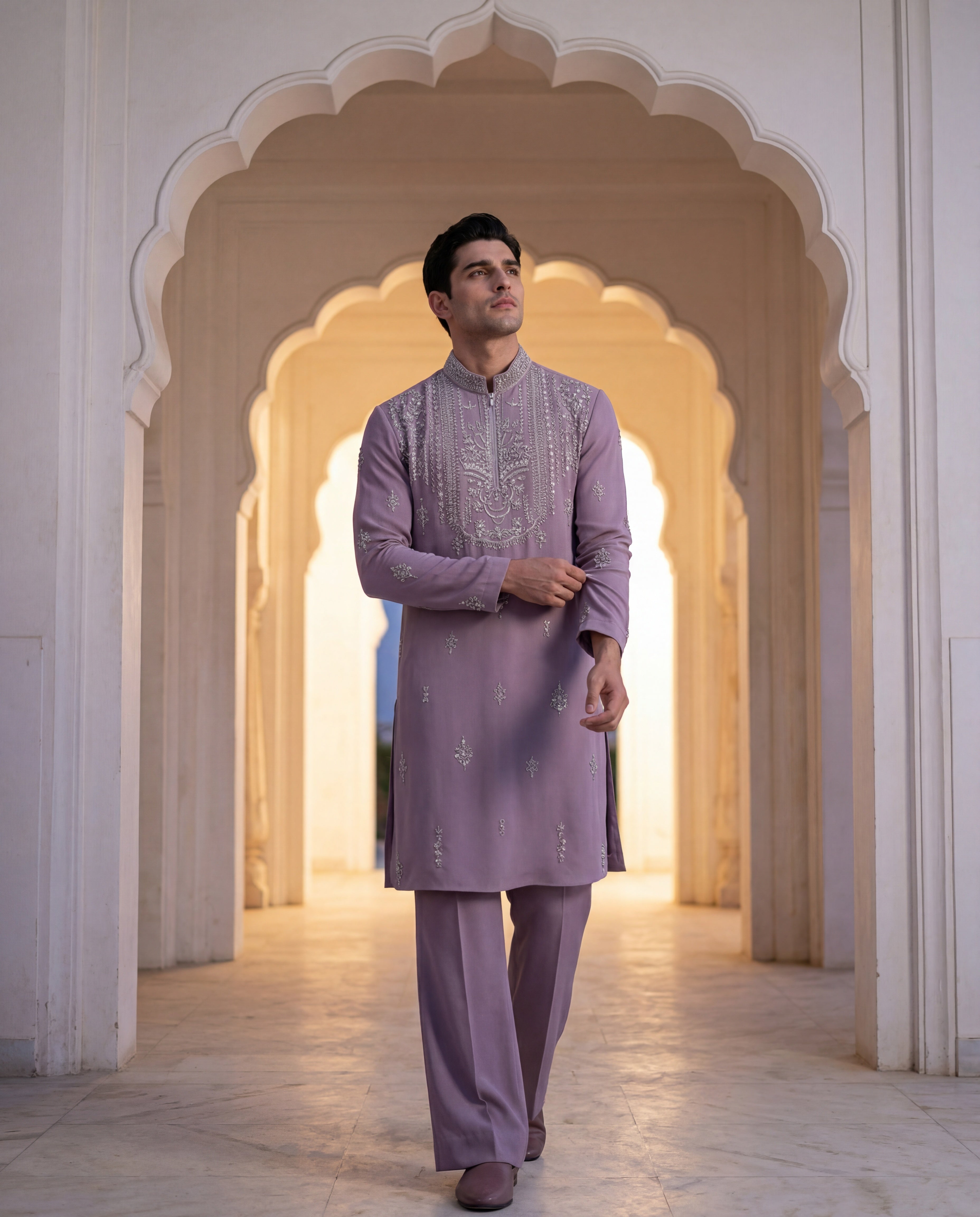 Mauve knit kurta with intricate silver hand embroidery at the neckline and scattered motifs, paired with matching palazzo.