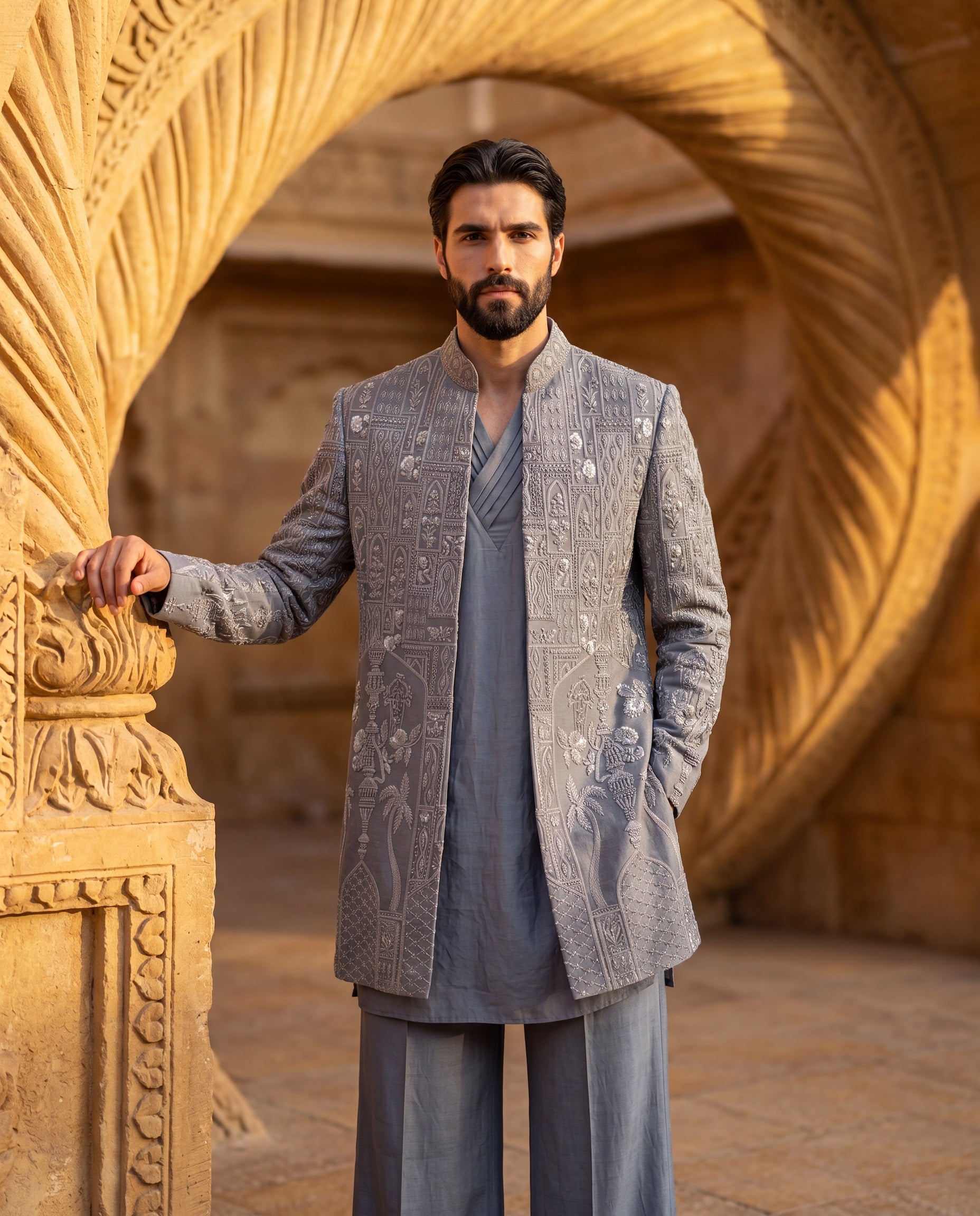Grey Linen rayon Indo-Western jacket with monoton embroidery detailing, paired with a pleated neckline kurta and matching linen rayon pants.
