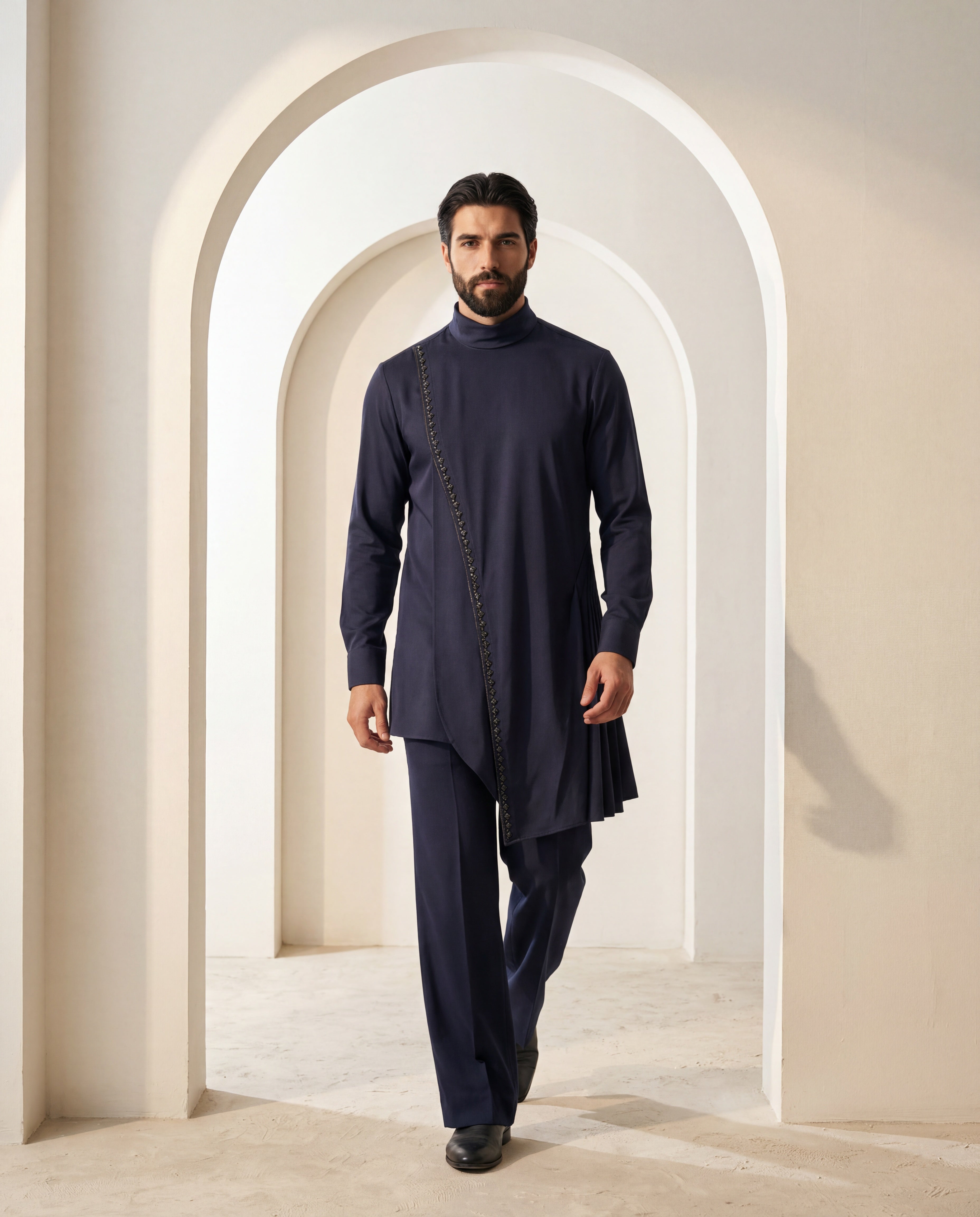 Navy blue asymmetric cut knit kurta with metallic embroidered detailing, paired with matching knit palazzo.