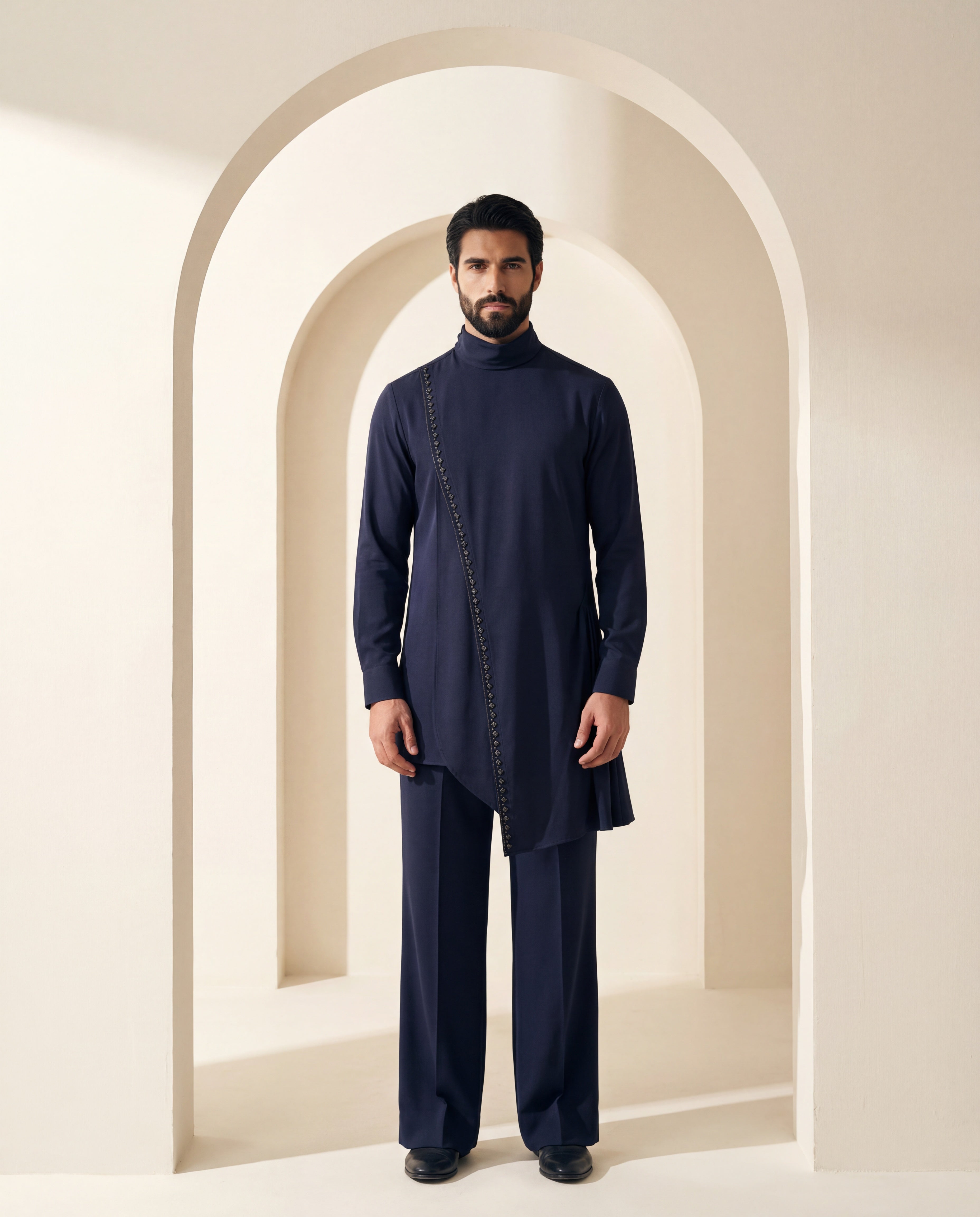 Navy blue asymmetric cut knit kurta with metallic embroidered detailing, paired with matching knit palazzo.