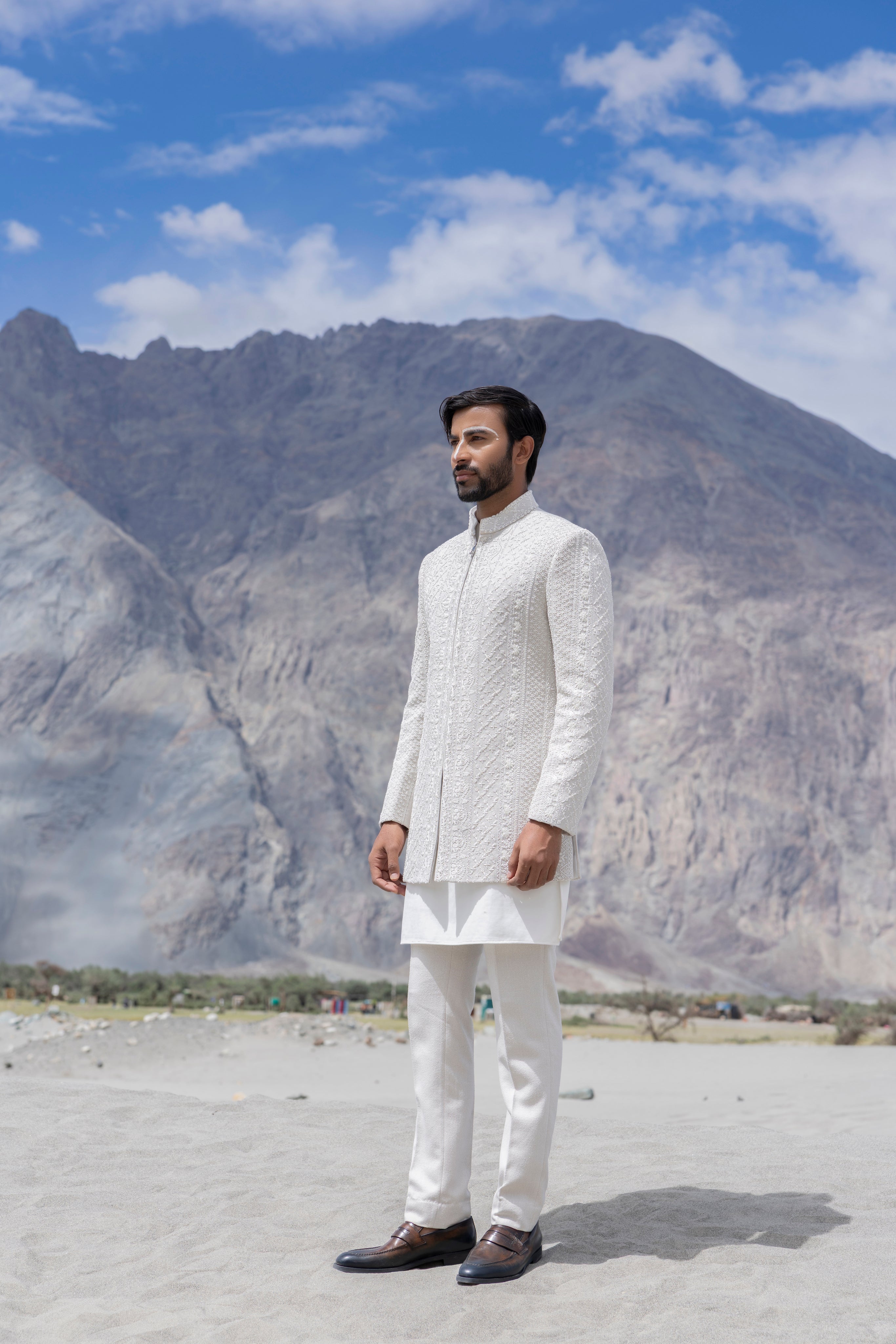 Ivoy indowestern jacket with front zipper and monotone hand-embroidery paired with a matching kurta and pants.
