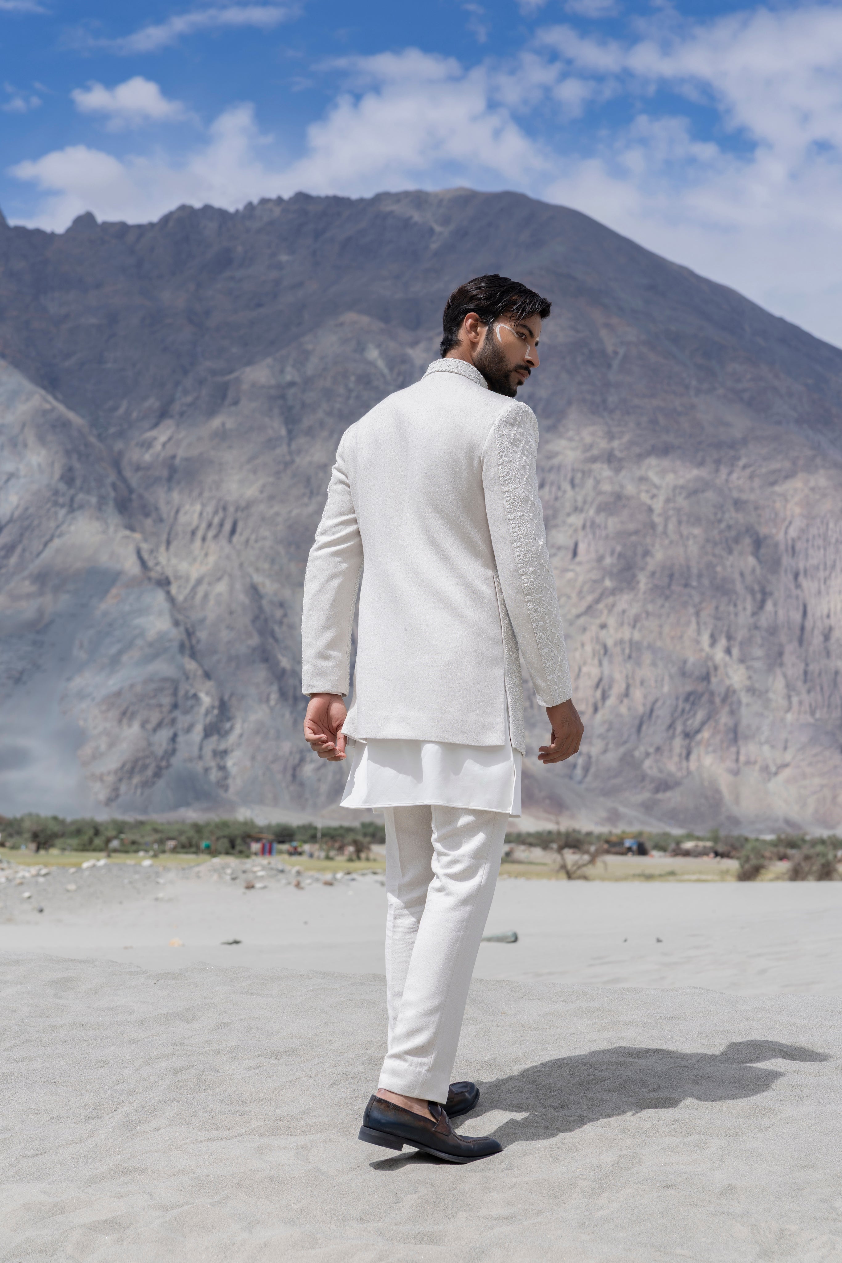 Ivoy indowestern jacket with front zipper and monotone hand-embroidery paired with a matching kurta and pants.