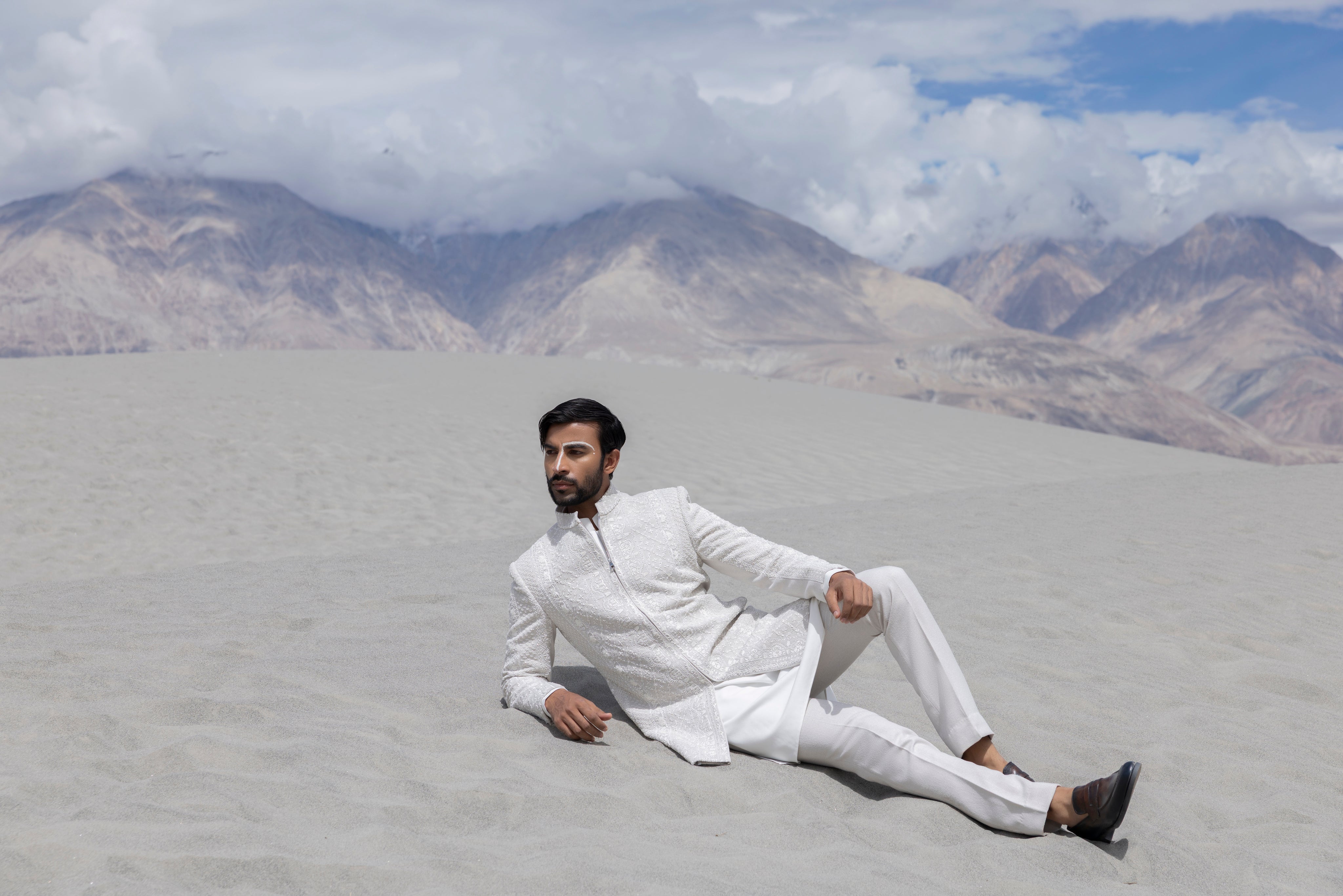 Ivoy indowestern jacket with front zipper and monotone hand-embroidery paired with a matching kurta and pants.