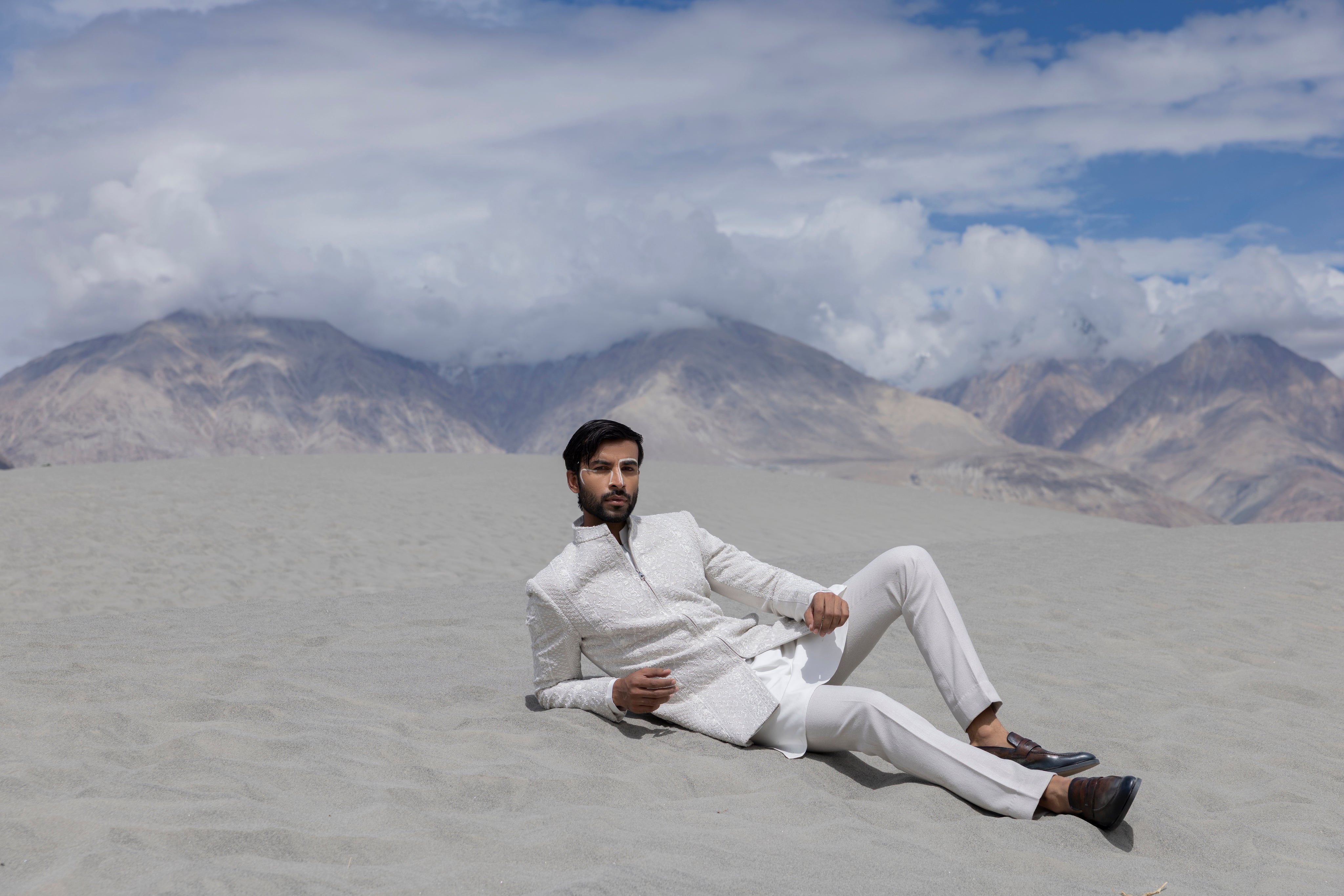 Ivoy indowestern jacket with front zipper and monotone hand-embroidery paired with a matching kurta and pants.