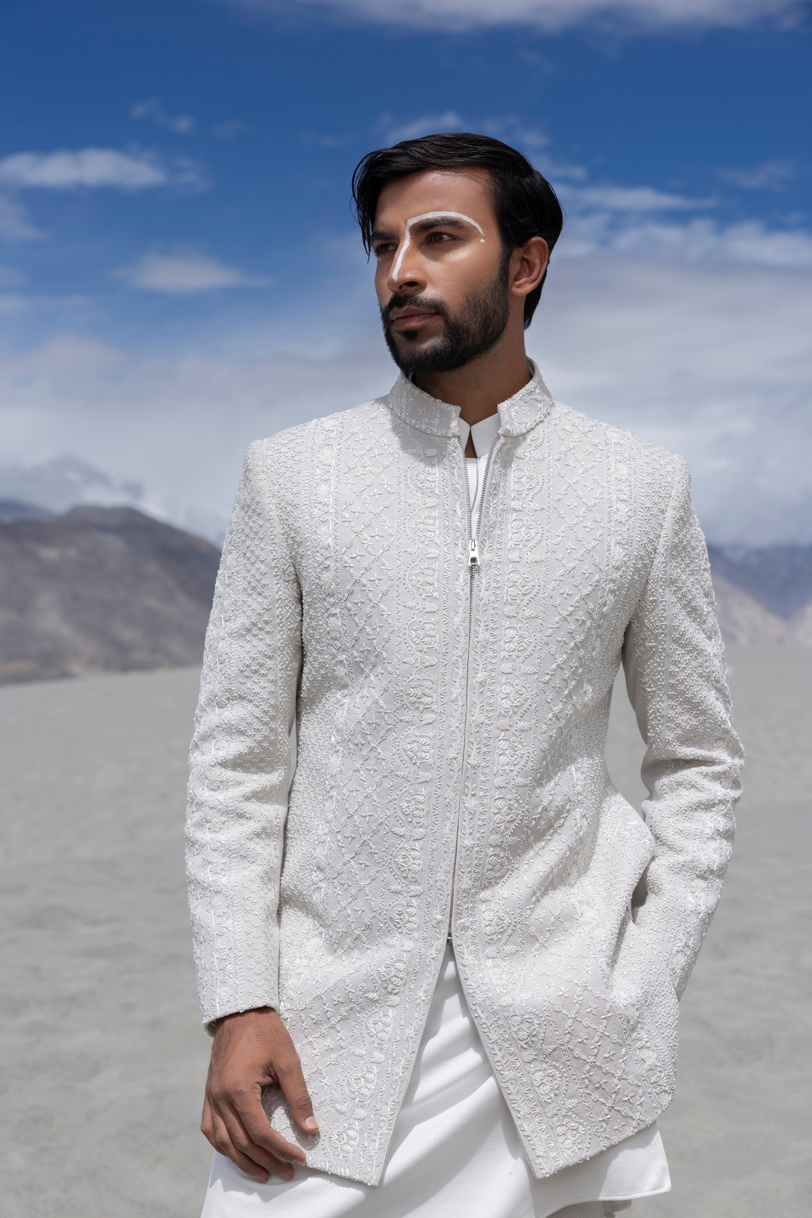 Ivoy indowestern jacket with front zipper and monotone hand-embroidery paired with a matching kurta and pants.