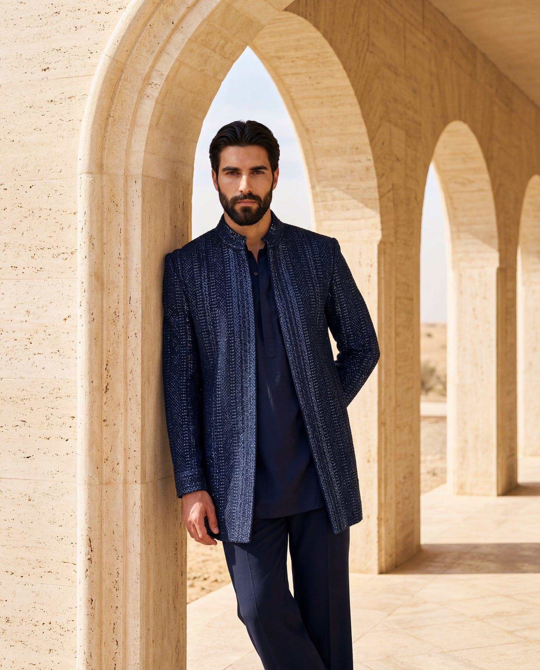 Crochet Indo-Western jacket with tonal embroidery detailing, paired with a knit kurta and matching palazzo.
