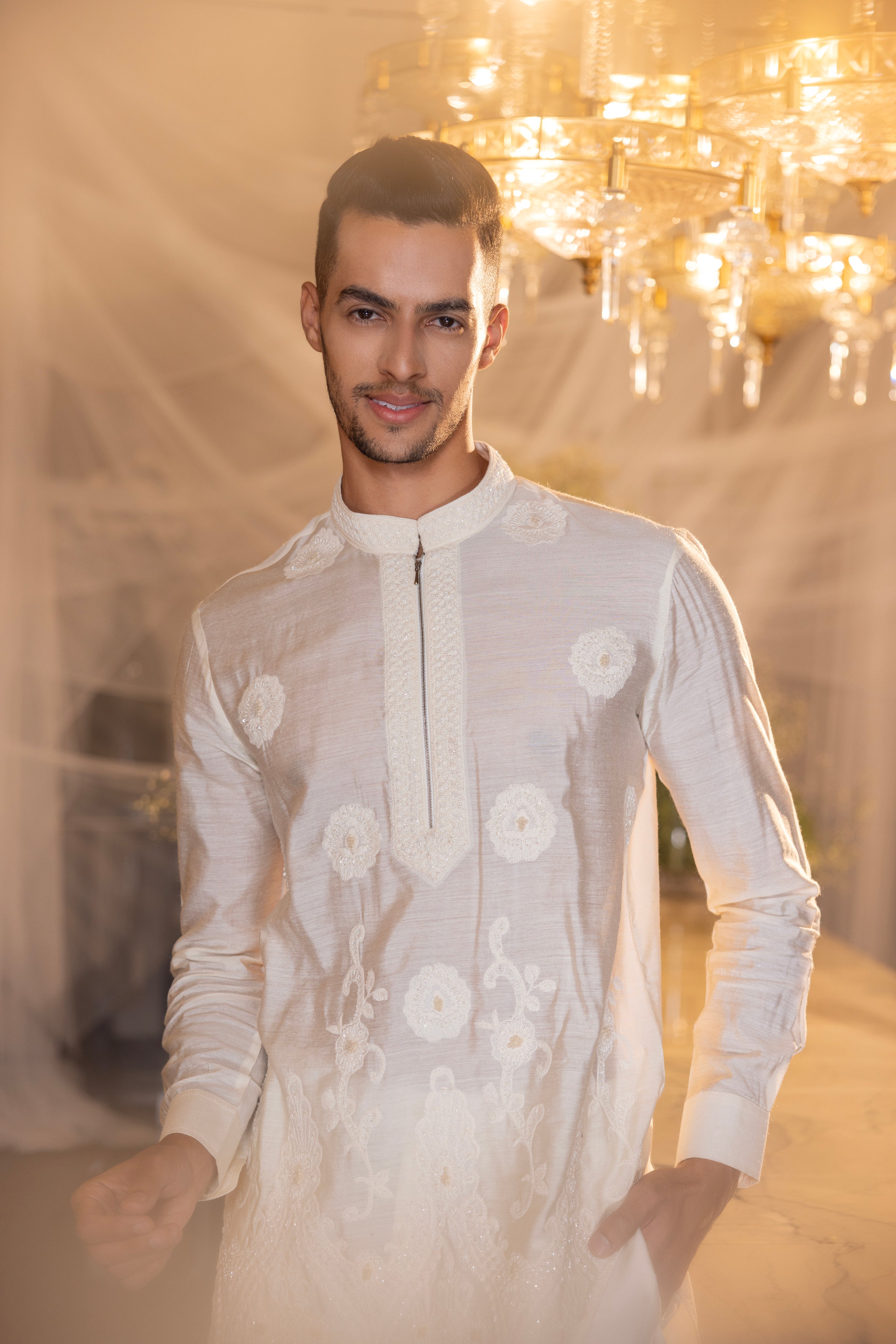 Cream hand-embroidered short kurta paired with a matching aligadhi.