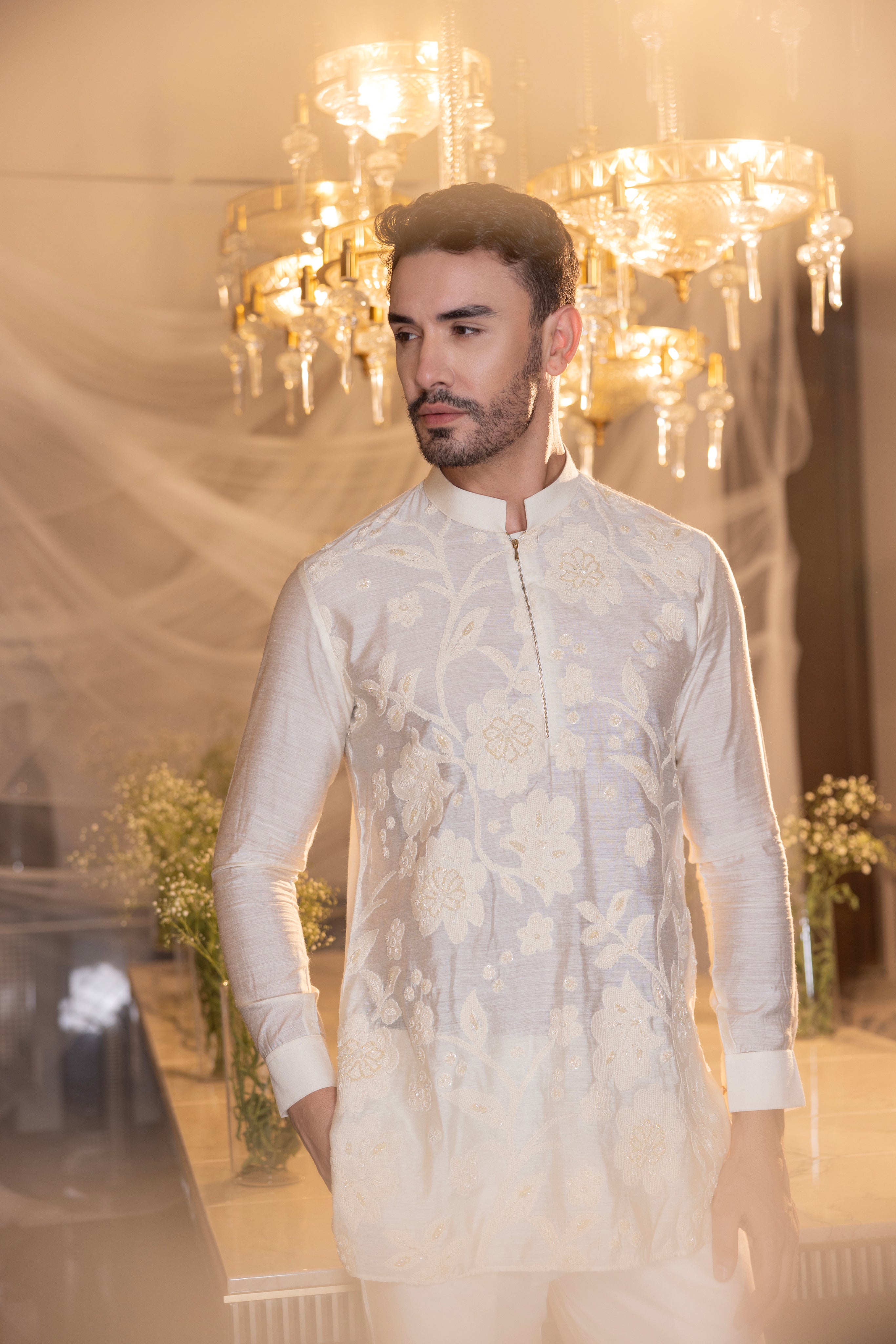 Cream hand-embroidered short kurta paired with a matching aligadhi.