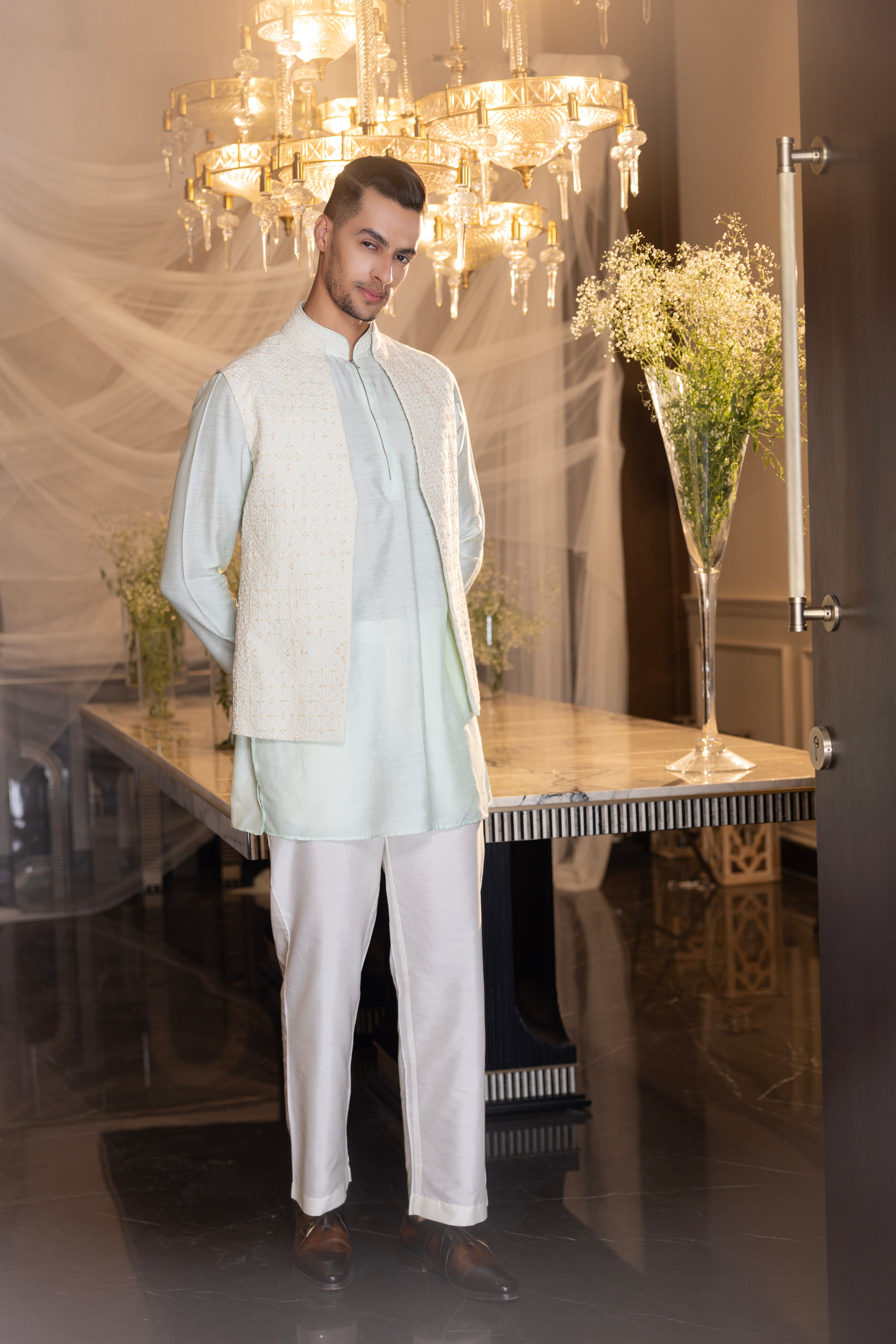 Mint Crochet hand embroidered waistcoat  paired with an embrodered kurta and aligadhi.