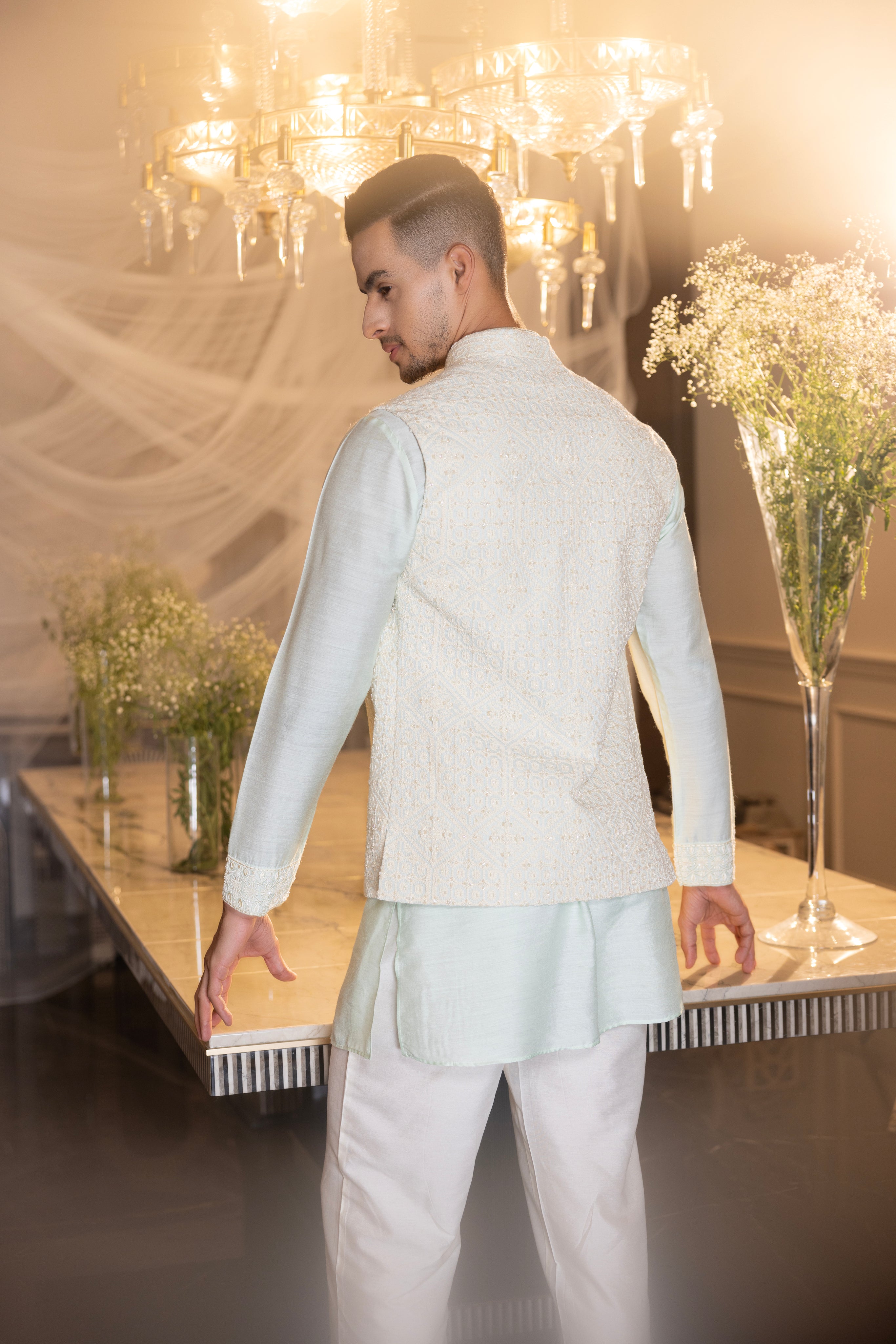 Mint Crochet hand embroidered waistcoat  paired with an embrodered kurta and aligadhi.