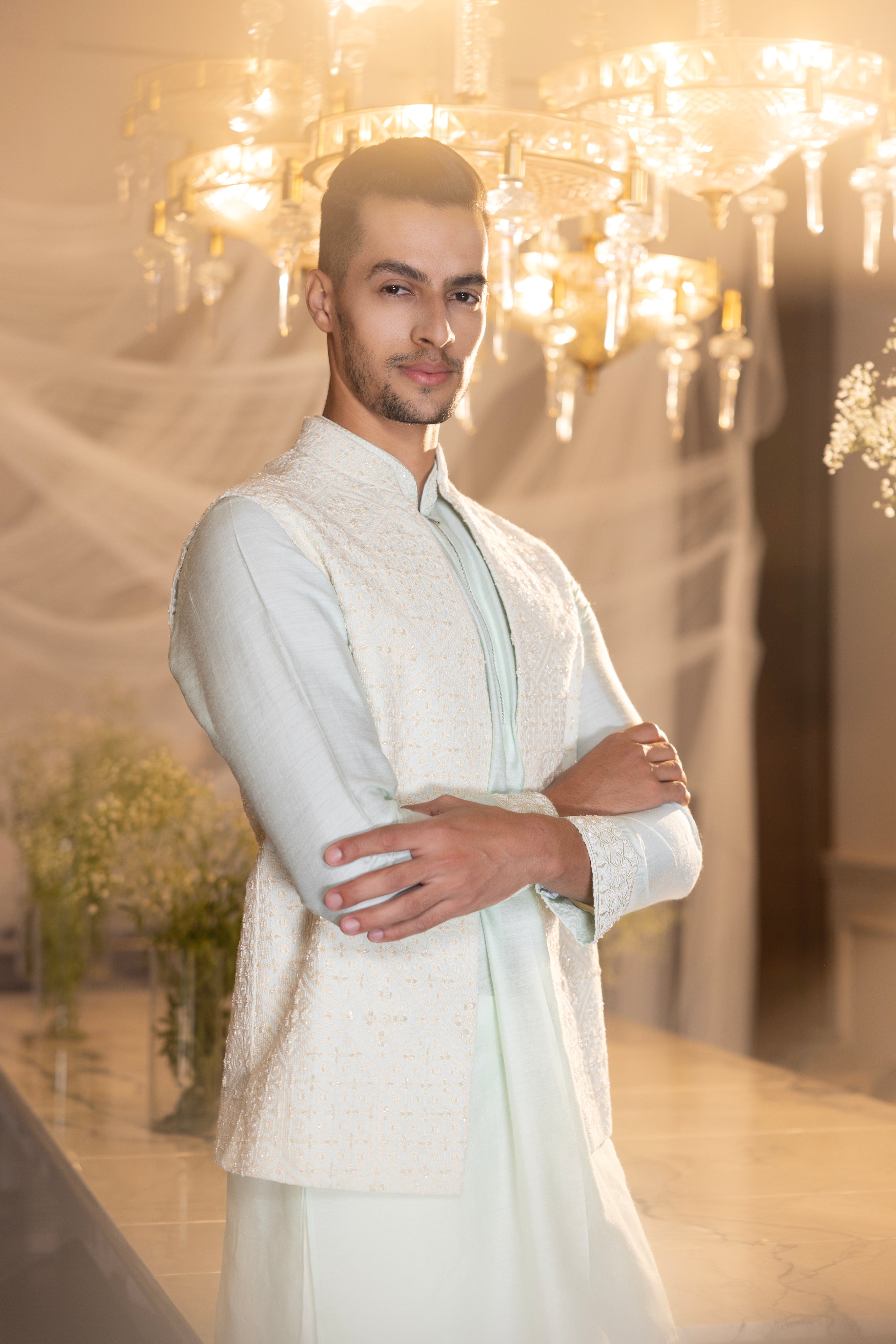 Mint Crochet hand embroidered waistcoat  paired with an embrodered kurta and aligadhi.