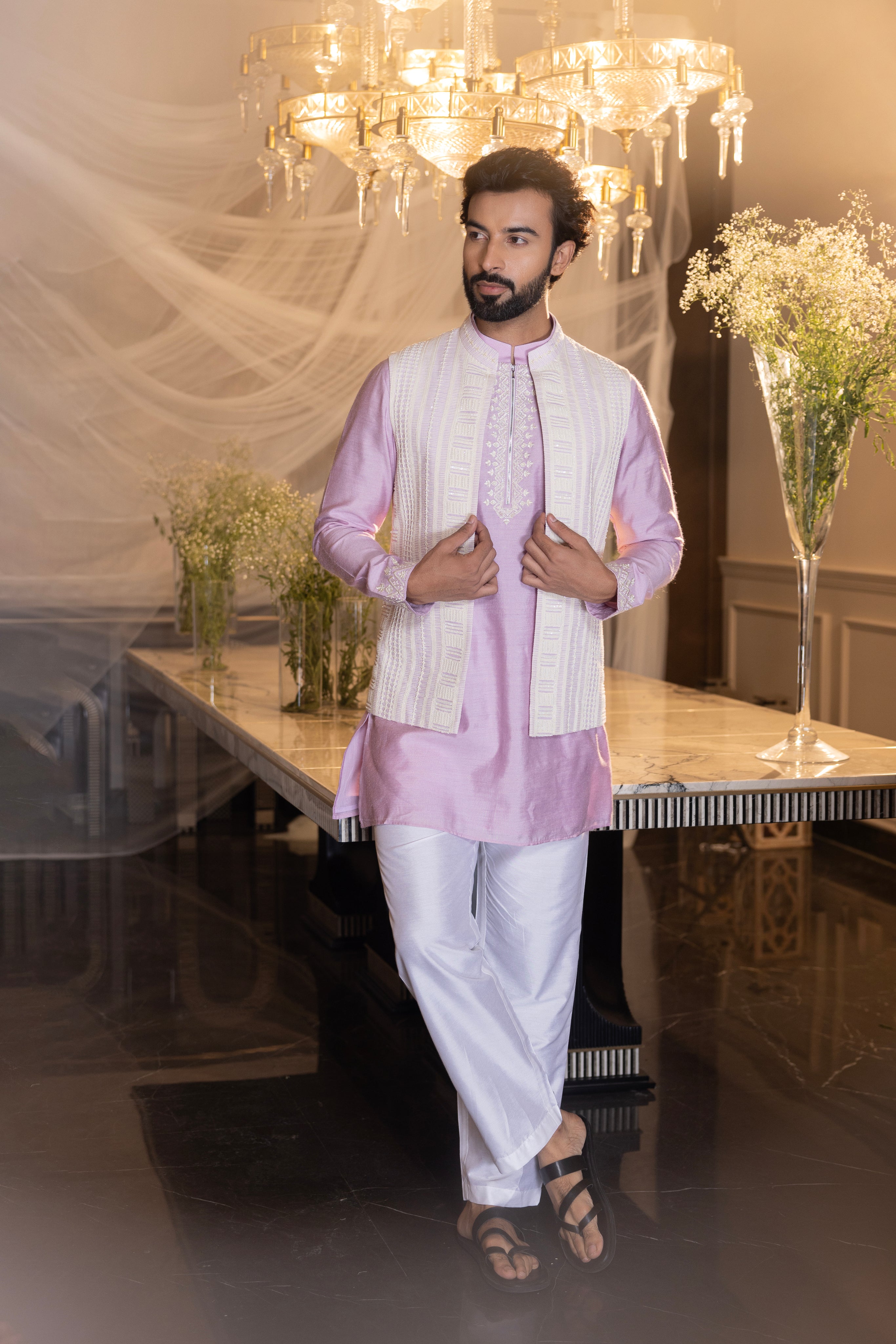 Lilac Crochet hand embroidered waistcoat   paired with an embrodered kurta and aligadhi.
