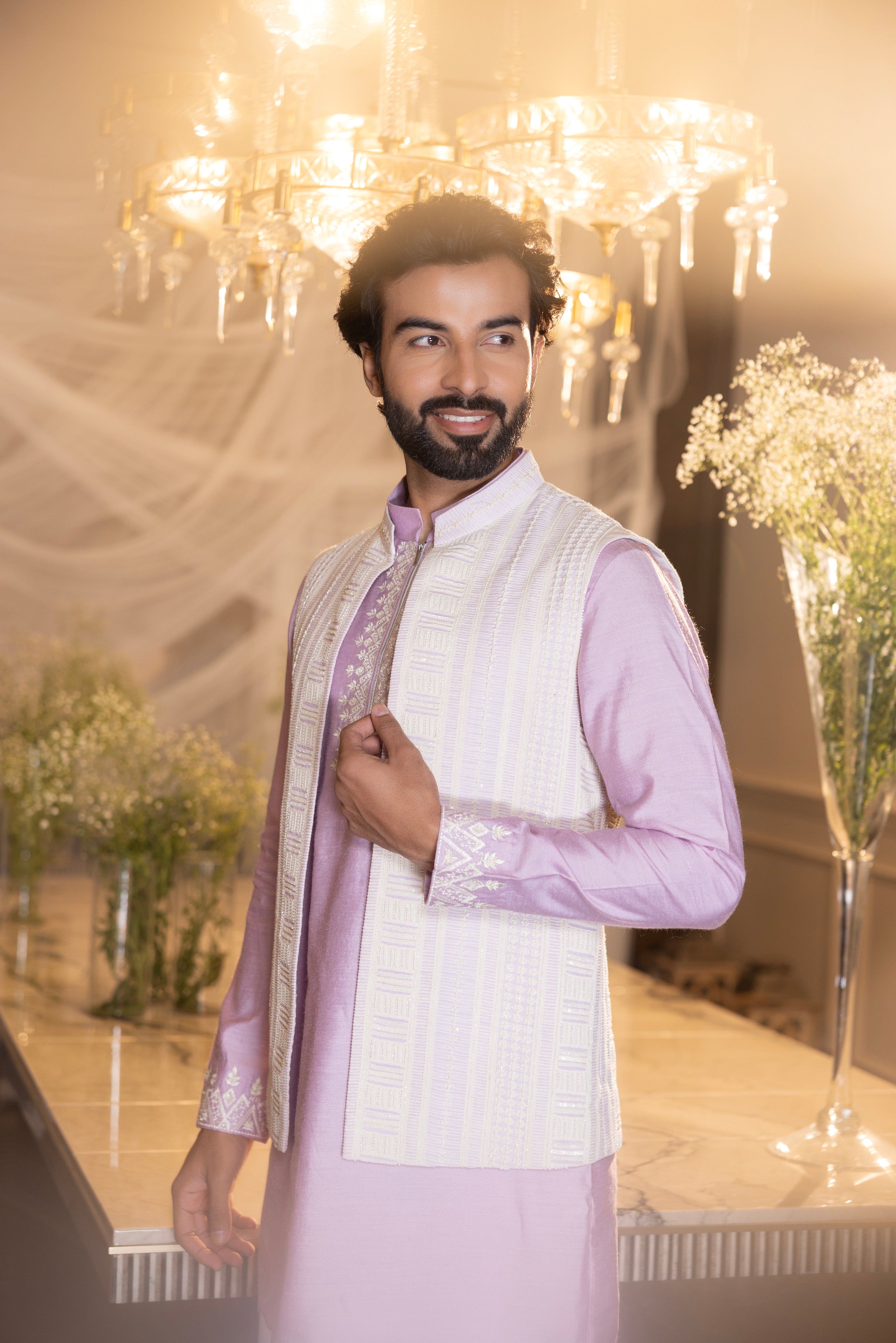 Lilac Crochet hand embroidered waistcoat   paired with an embrodered kurta and aligadhi.
