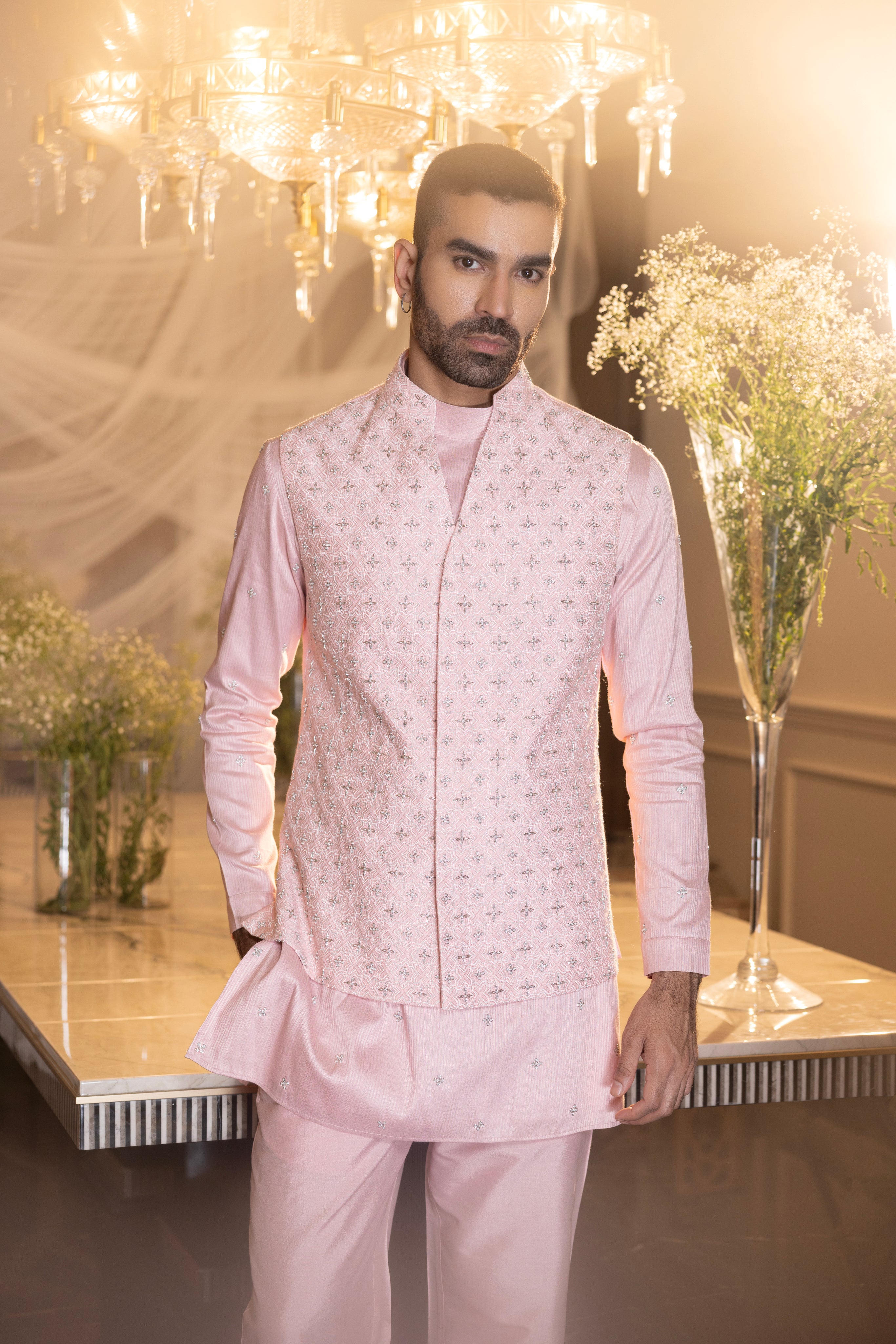 Banarasi Silk Baby pink hand-embroidered  waistcoat  paired with an embroidered kurta and matching aligadhi.