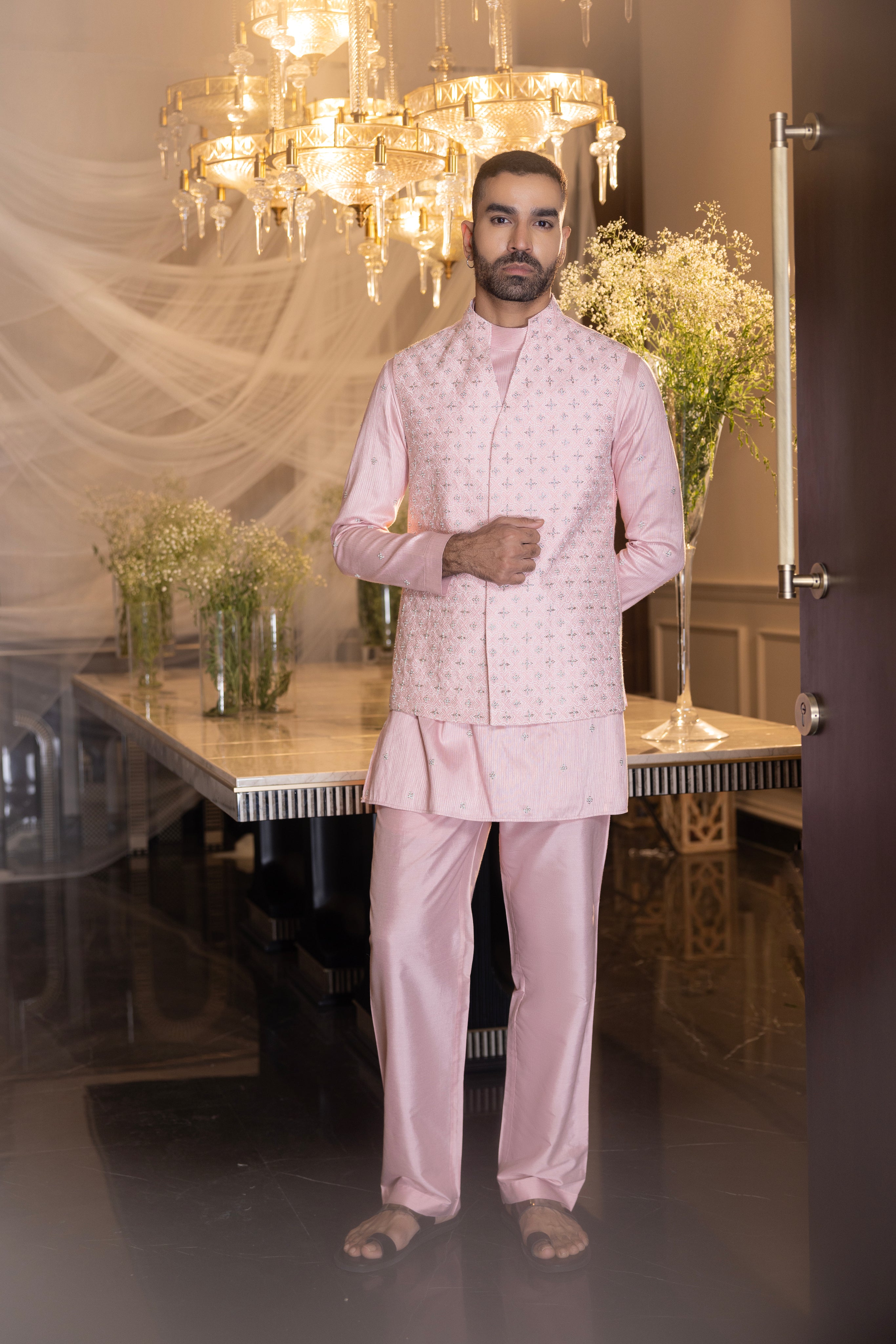 Banarasi Silk Baby pink hand-embroidered  waistcoat  paired with an embroidered kurta and matching aligadhi.
