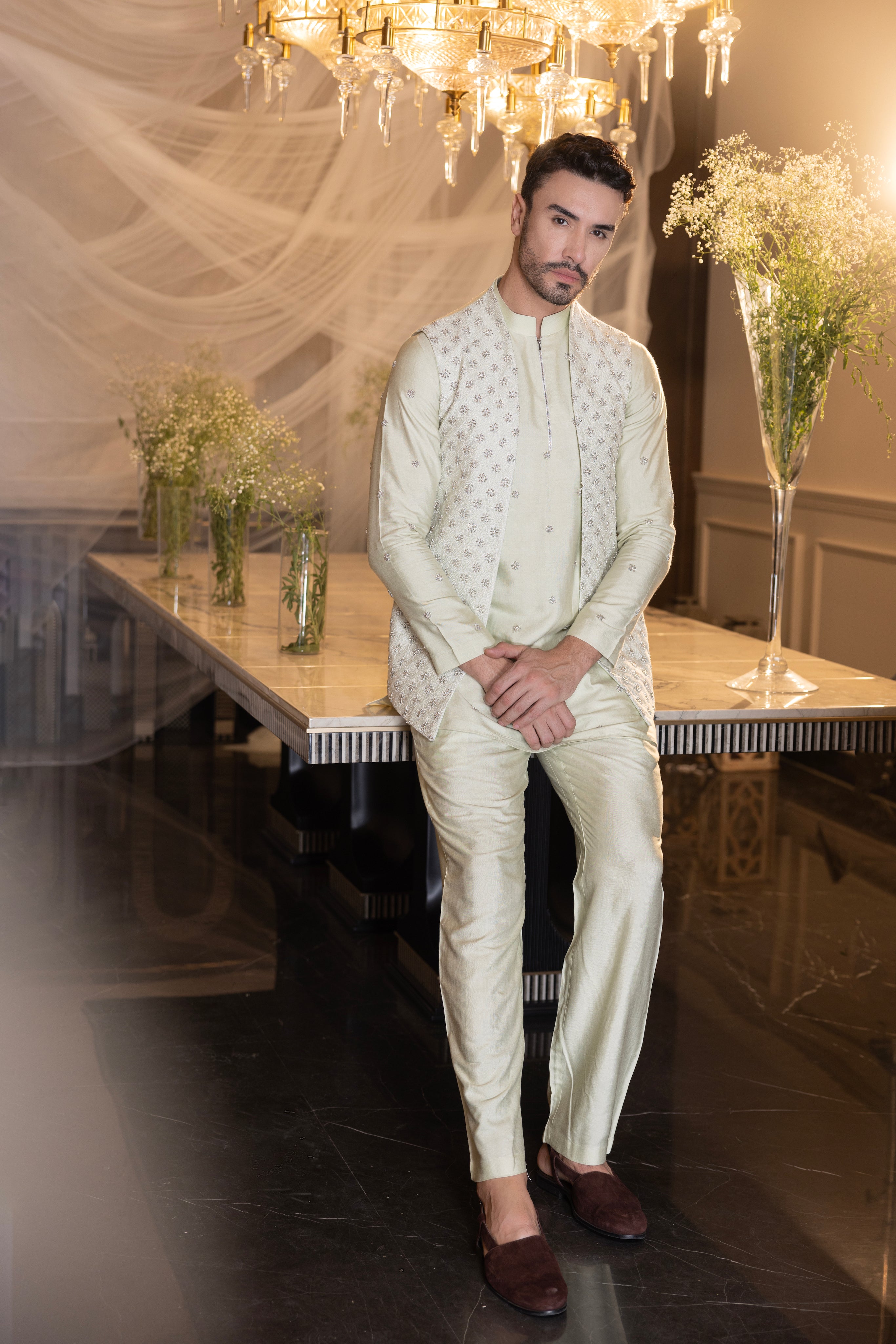 Banarasi Silk Mint Green hand-embroidered  waistcoat  paired with an embroidered kurta and matching aligadhi.
