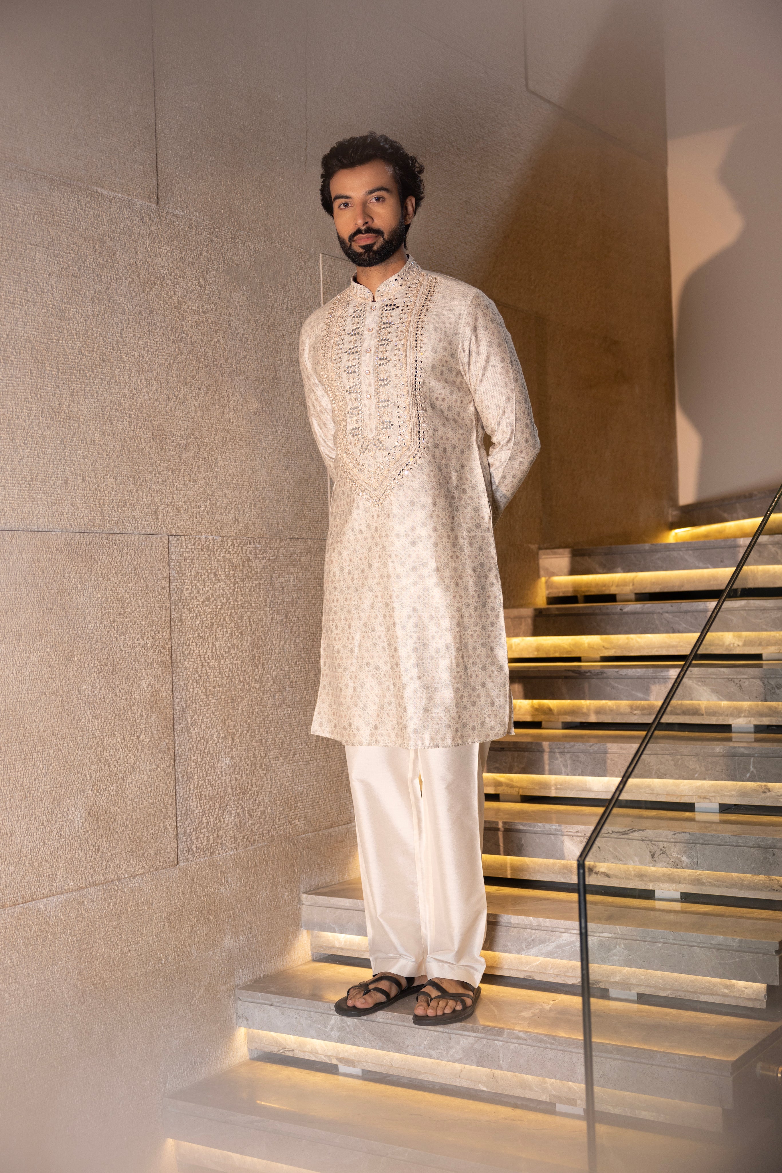 Cream floral digital print kurta accentuated with mirror work paired with a plain aligadhi.