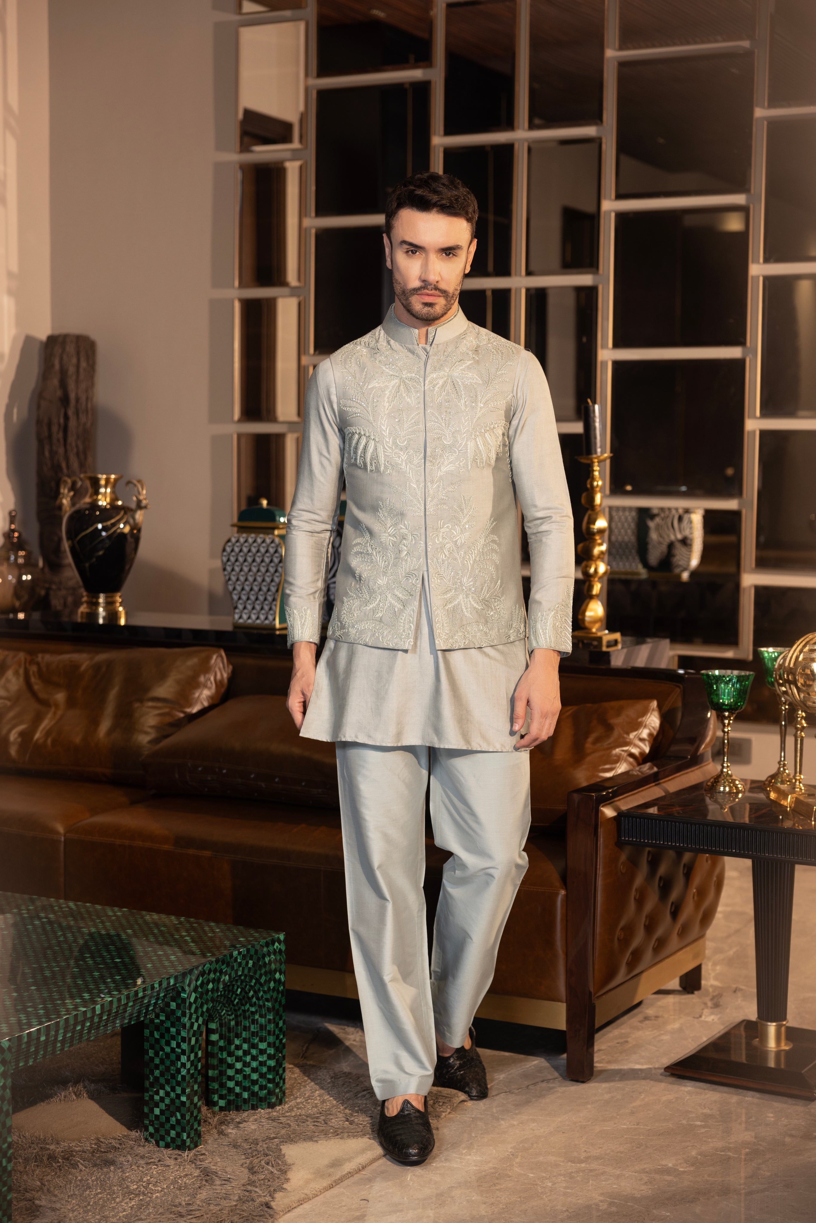 Mint Green waistcoat with intricate montone hand-embroidery paired with a matching kurta and  aligadhi set.
