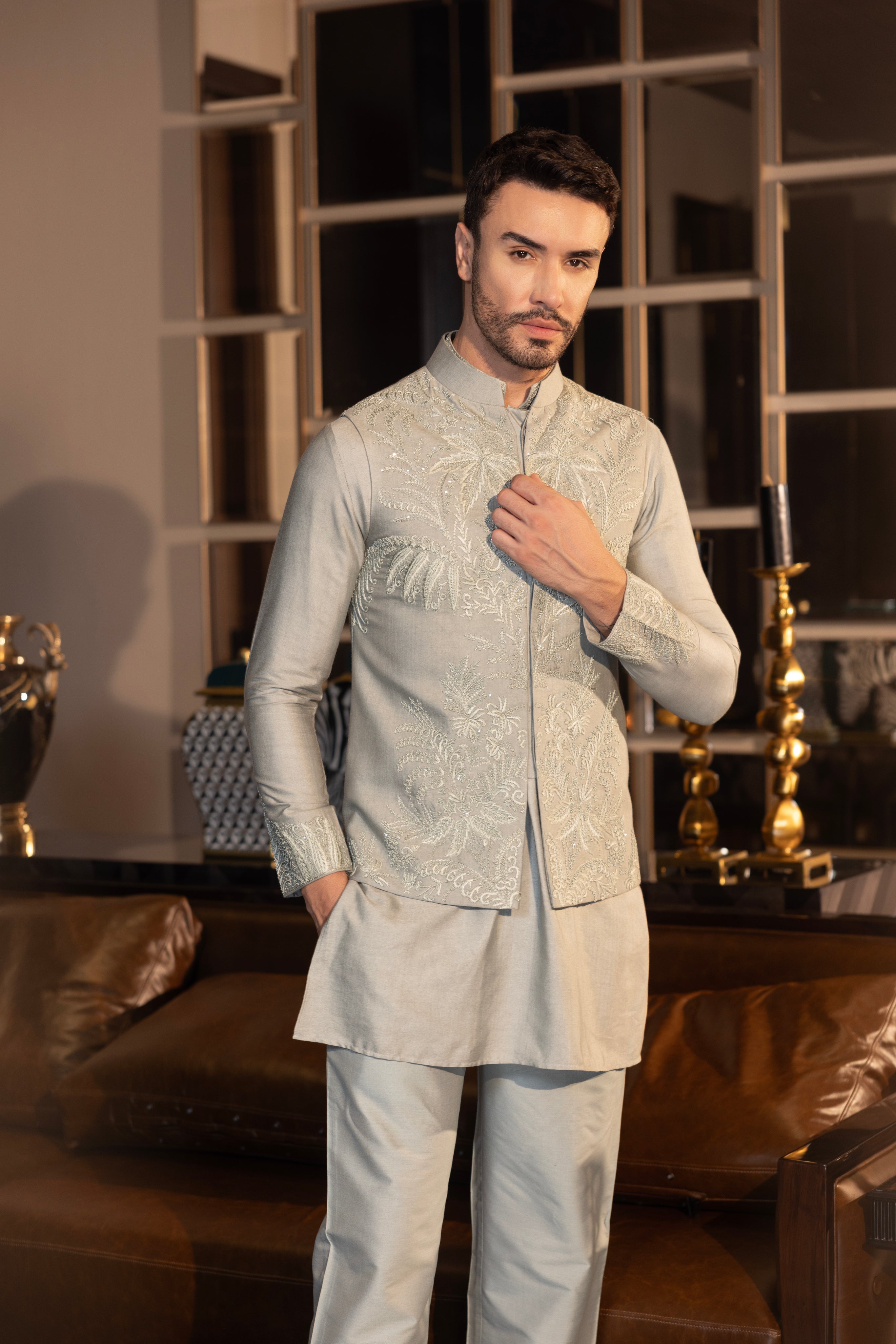 Mint Green waistcoat with intricate montone hand-embroidery paired with a matching kurta and  aligadhi set.