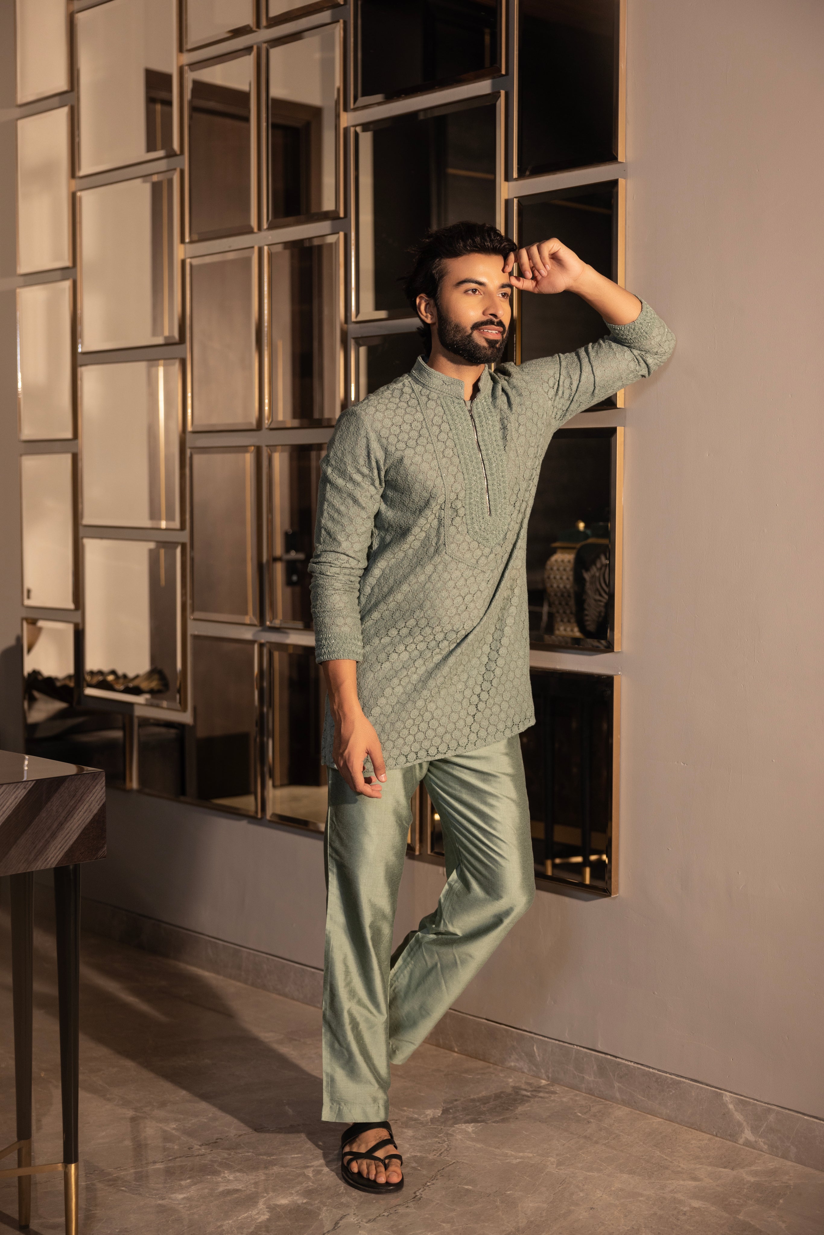 Hand-embroidered green crochet short kurta paired with a matching aligadhi set.