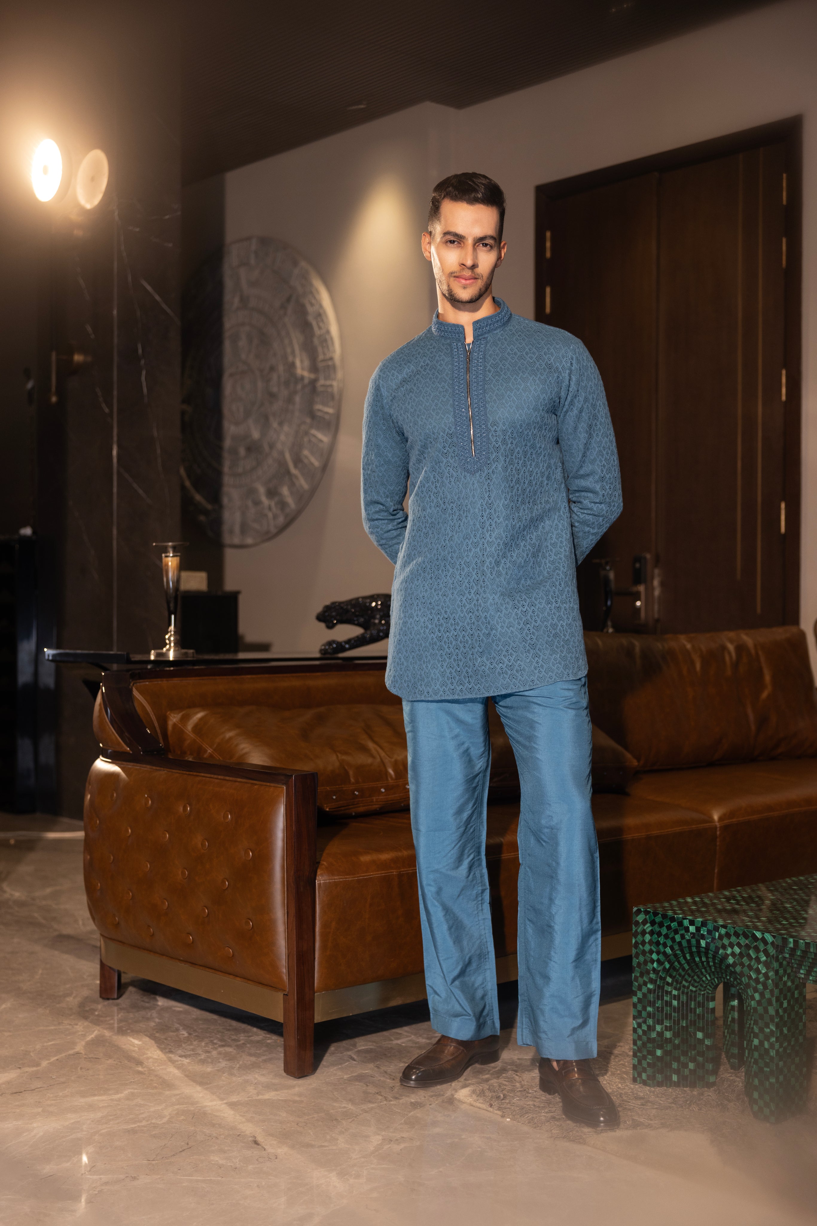 Hand-embroidered turquoise crochet kurta paired with a matching aligadhi set.