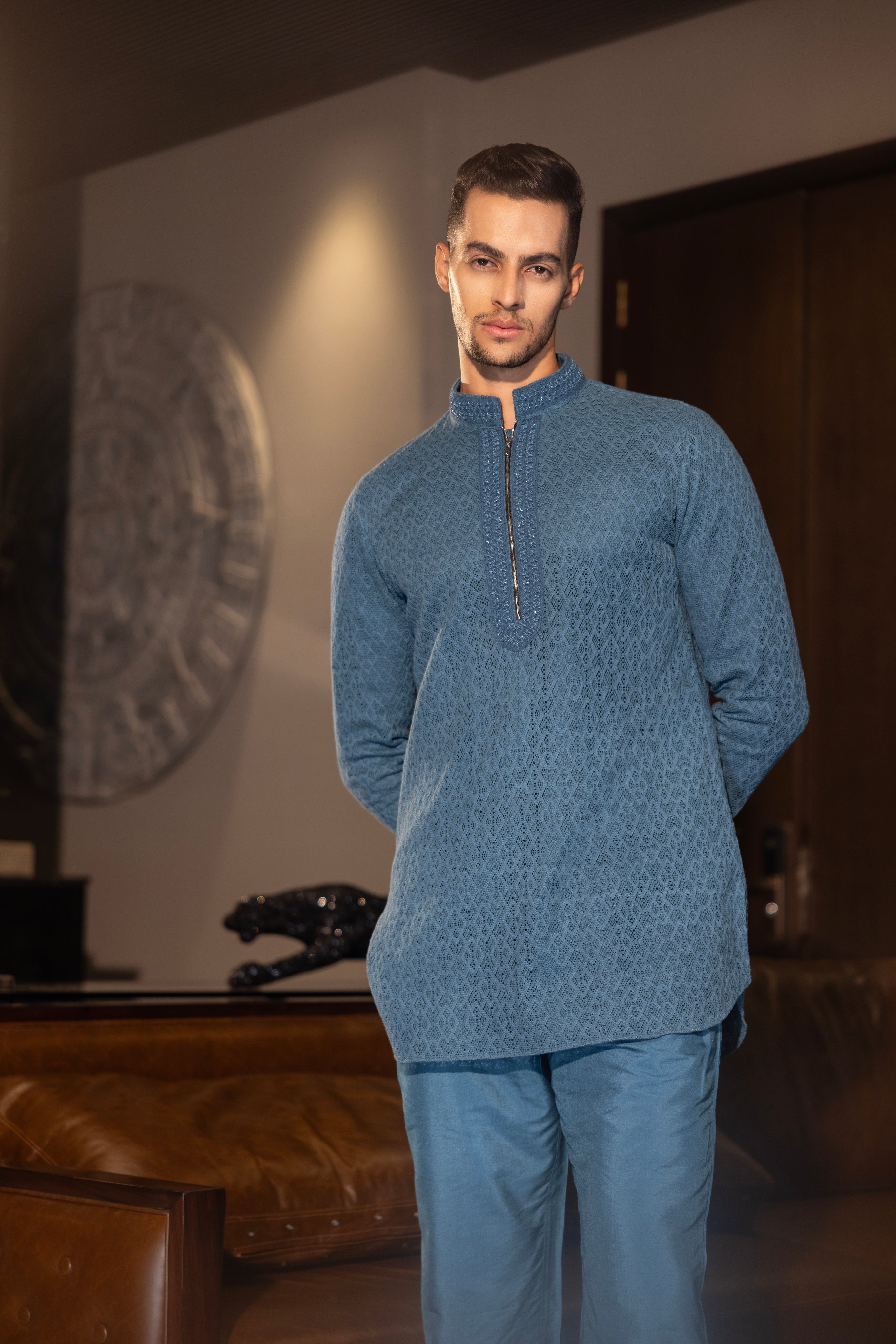 Hand-embroidered turquoise crochet kurta paired with a matching aligadhi set.