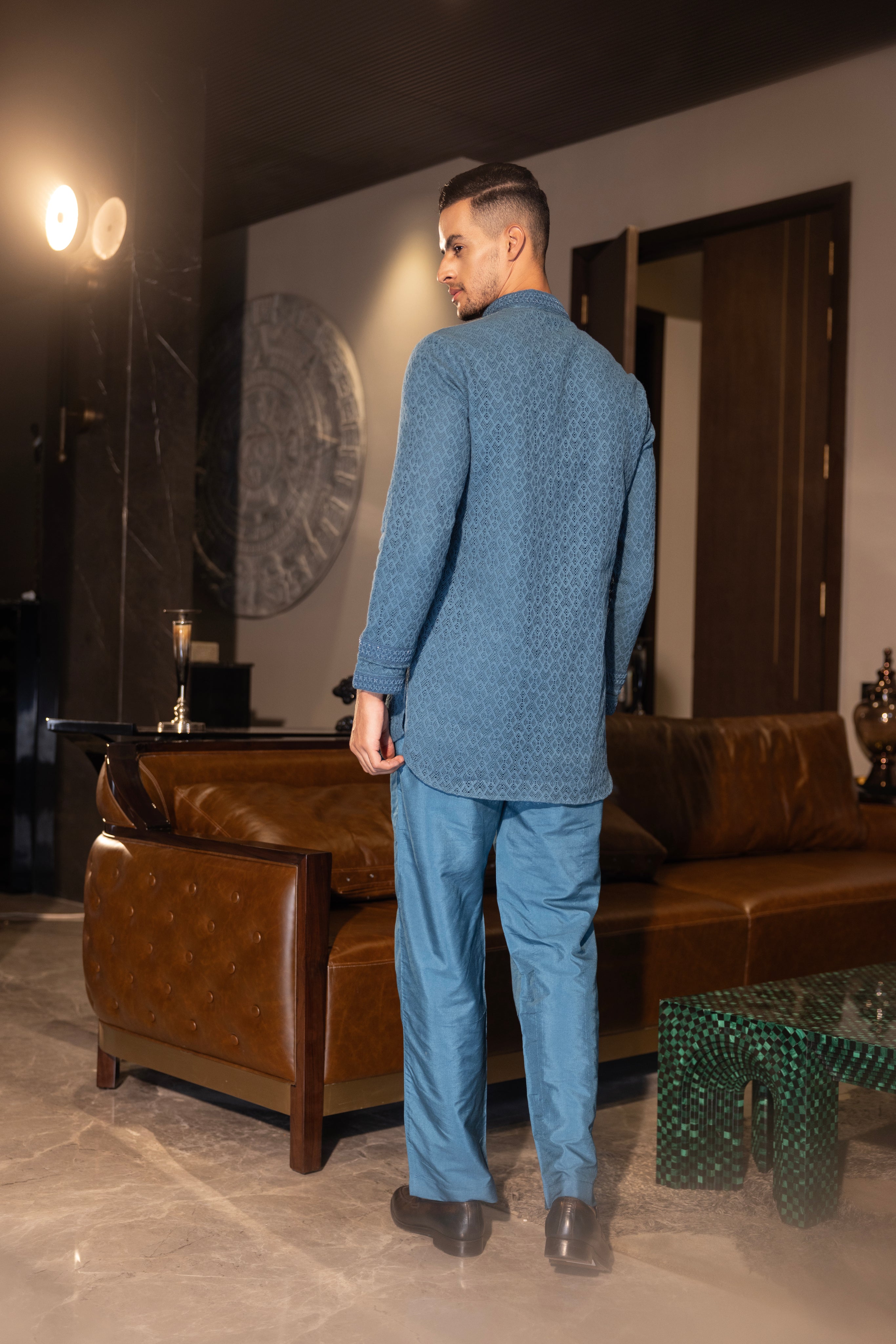 Hand-embroidered turquoise crochet kurta paired with a matching aligadhi set.
