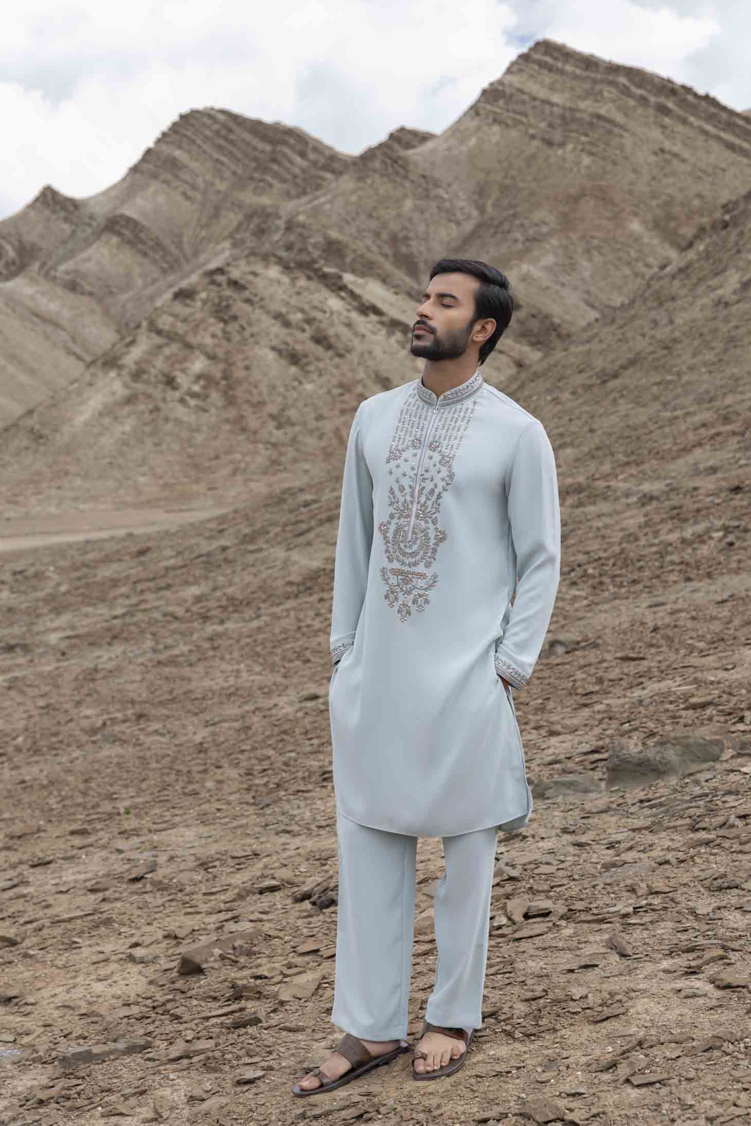 Teal Knit Kurta set with Metal Embellishments on Placket, Cuffs & Collar, Paired with Aligarhi Pants