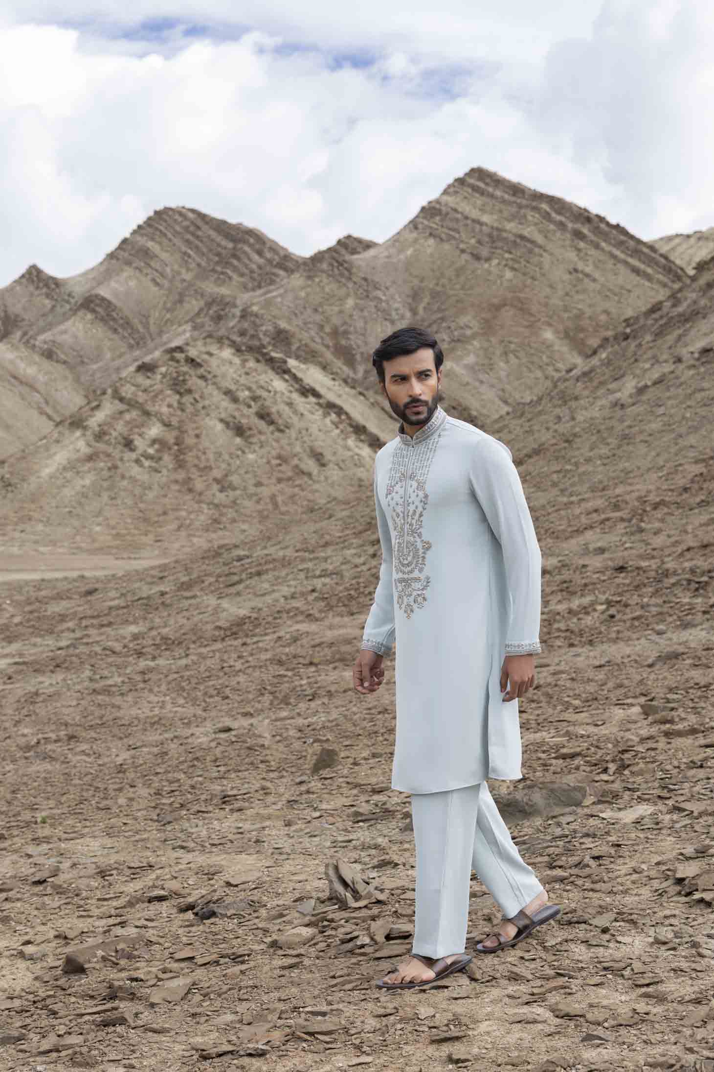 Teal Knit Kurta set with Metal Embellishments on Placket, Cuffs & Collar, Paired with Aligarhi Pants