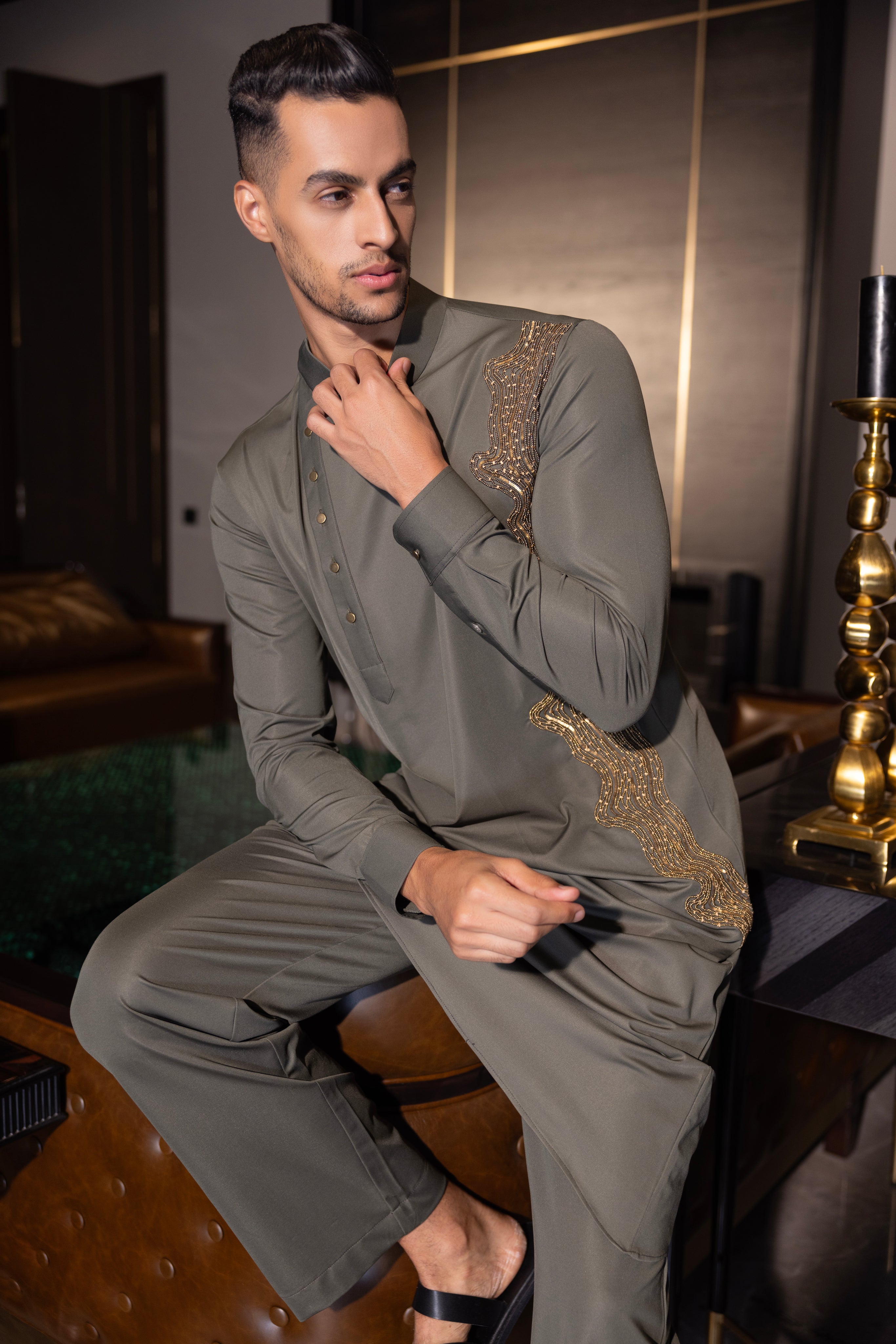 Olive green kurta with gold hand-embroidery detailing paired with a matching aligadhi set.