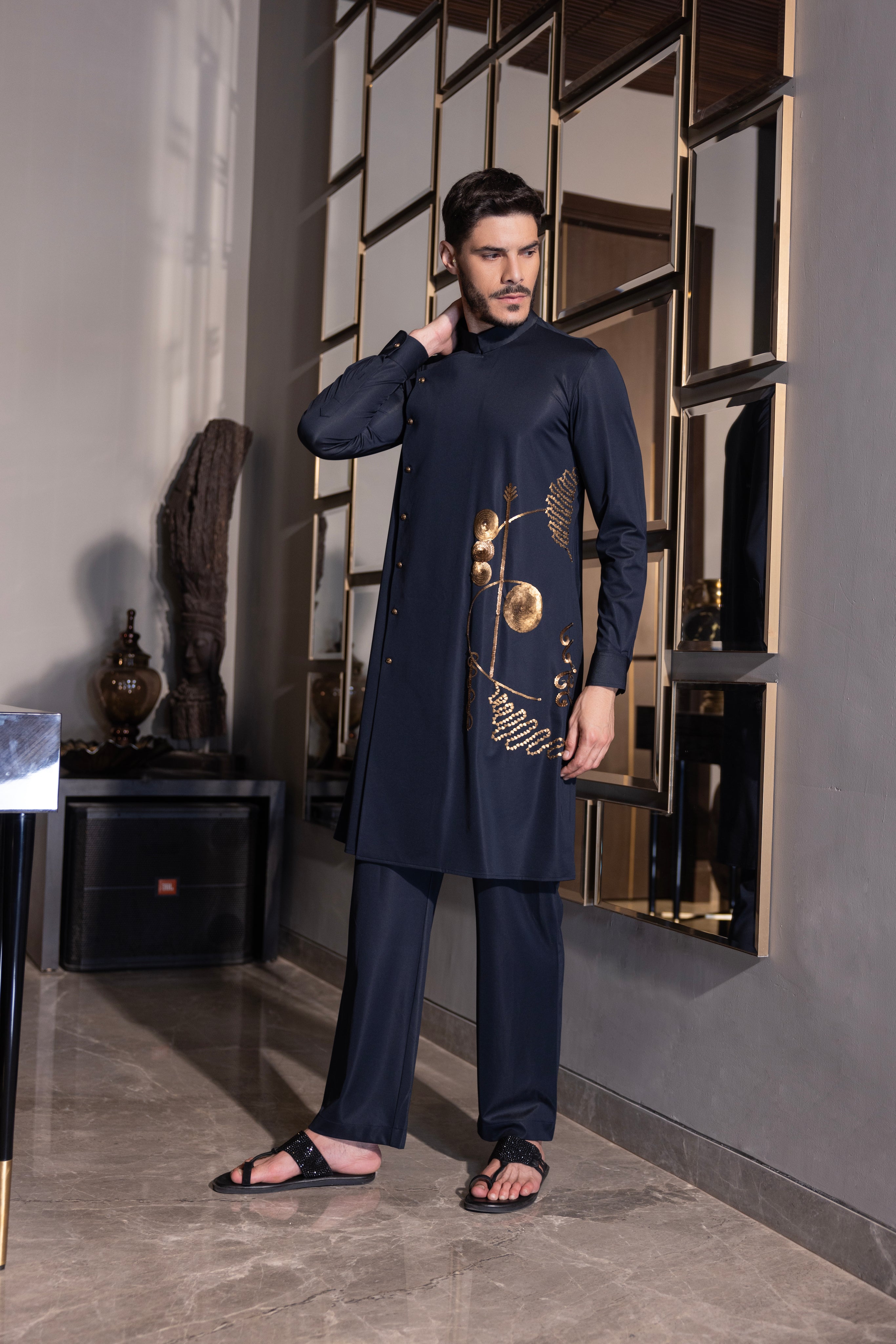 Navy Blue kurta with gold hand-embroidery detailing paired with a matching aligadhi set.