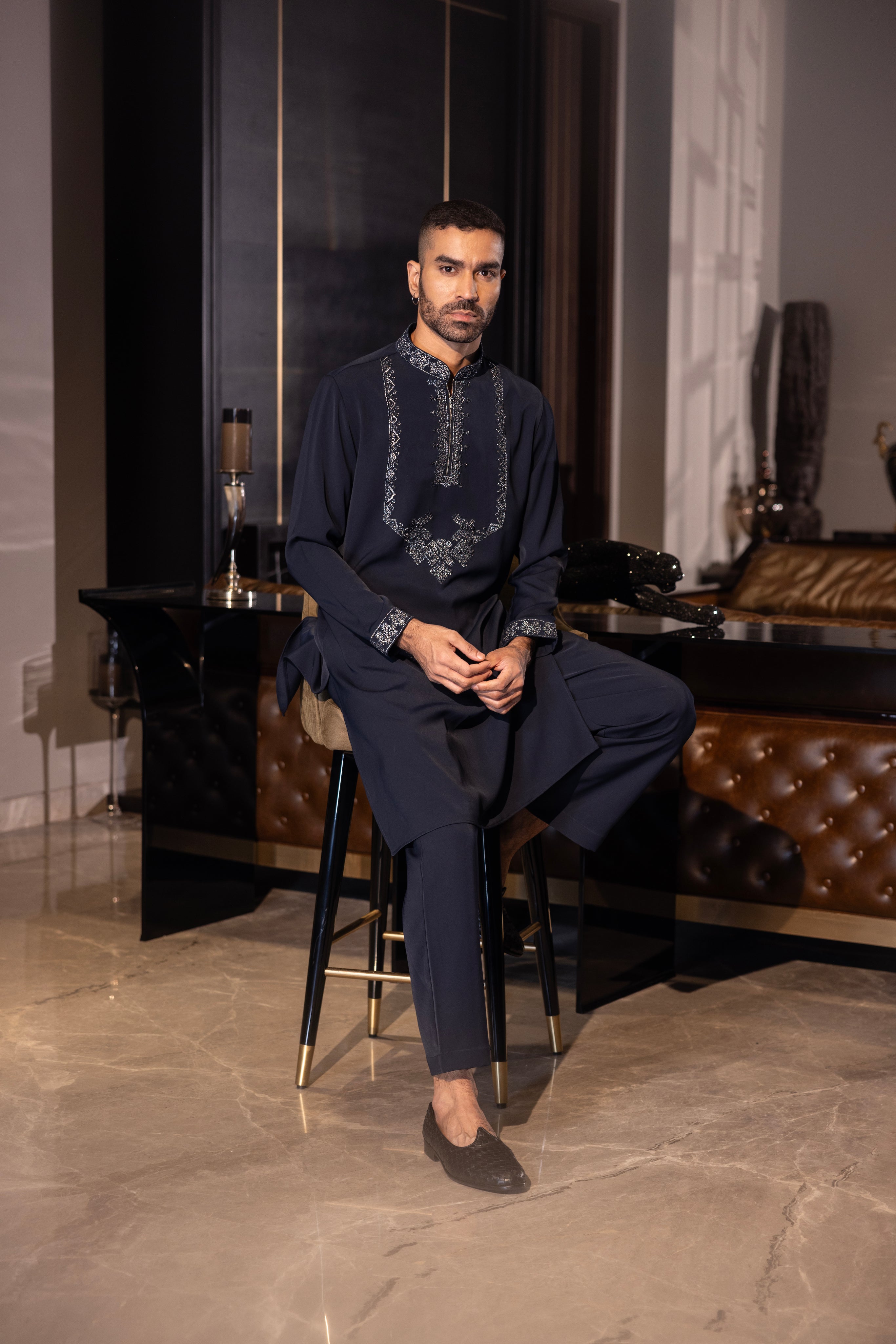 Navy Blue kurta with hand-embroidery detailing paired with a matching aligadhi set.