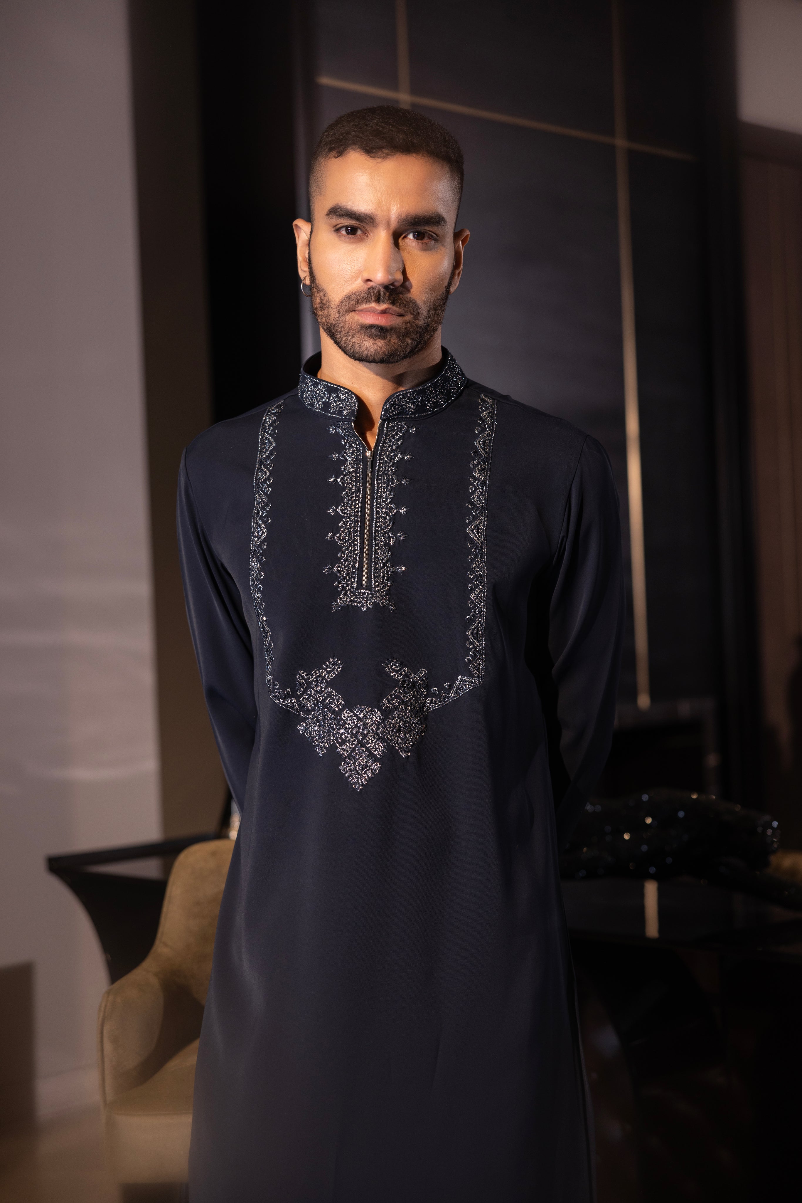 Navy Blue kurta with hand-embroidery detailing paired with a matching aligadhi set.