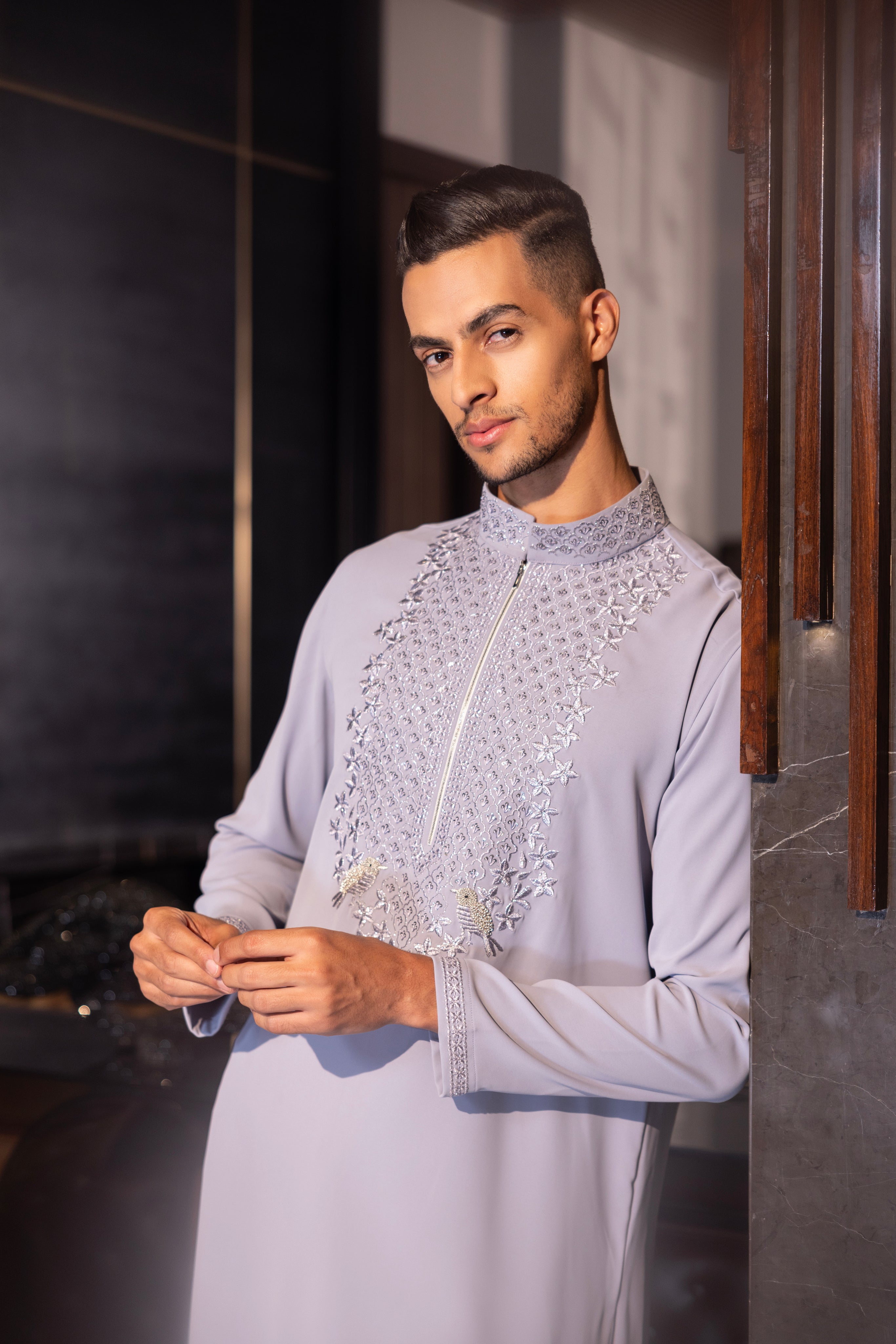 Lilac kurta with hand-embroidery detailing paired with a matching aligadhi set.