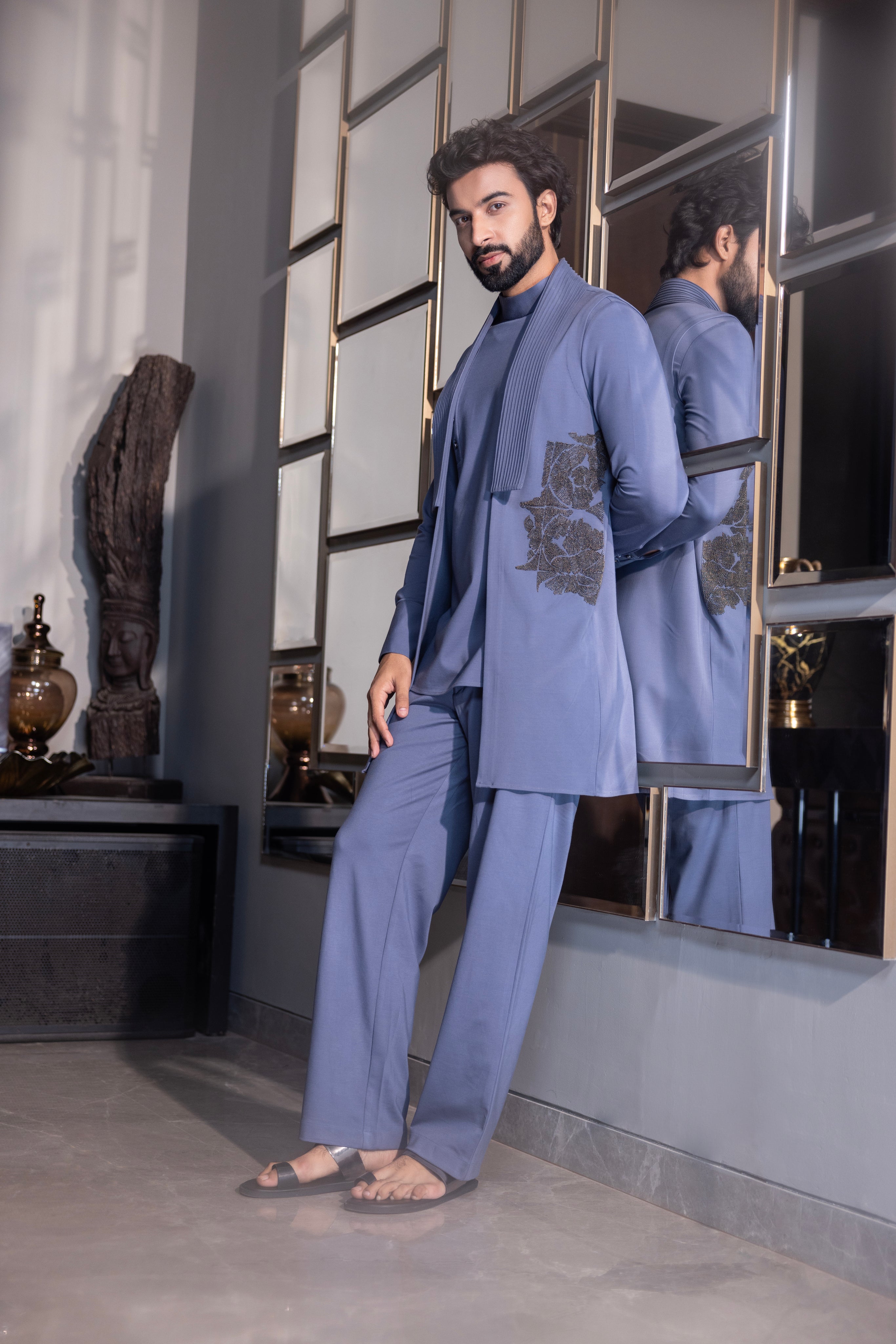 Purple kurta with hand-embroidery & draping details paired with a matching aligadhi set.