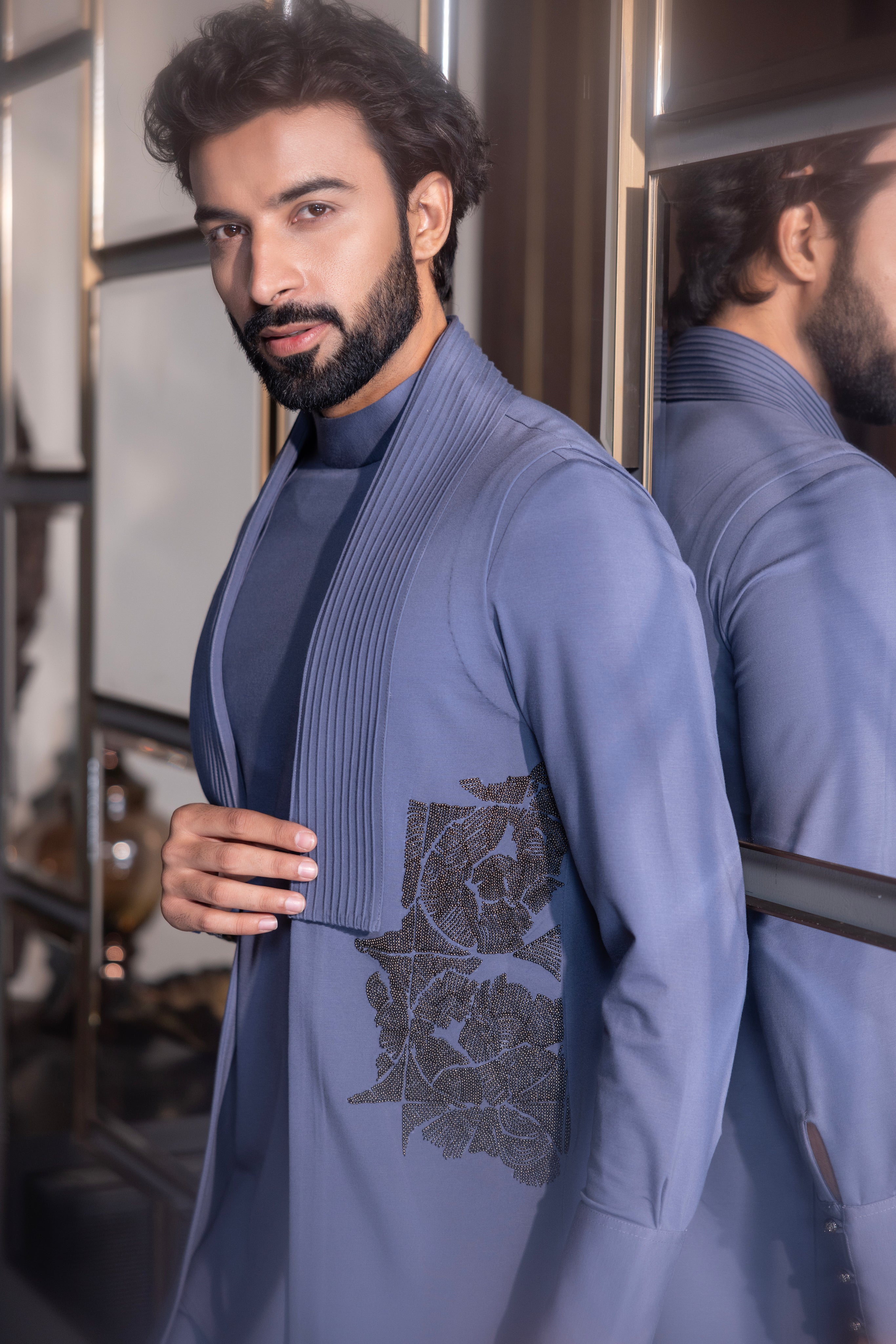 Purple kurta with hand-embroidery & draping details paired with a matching aligadhi set.