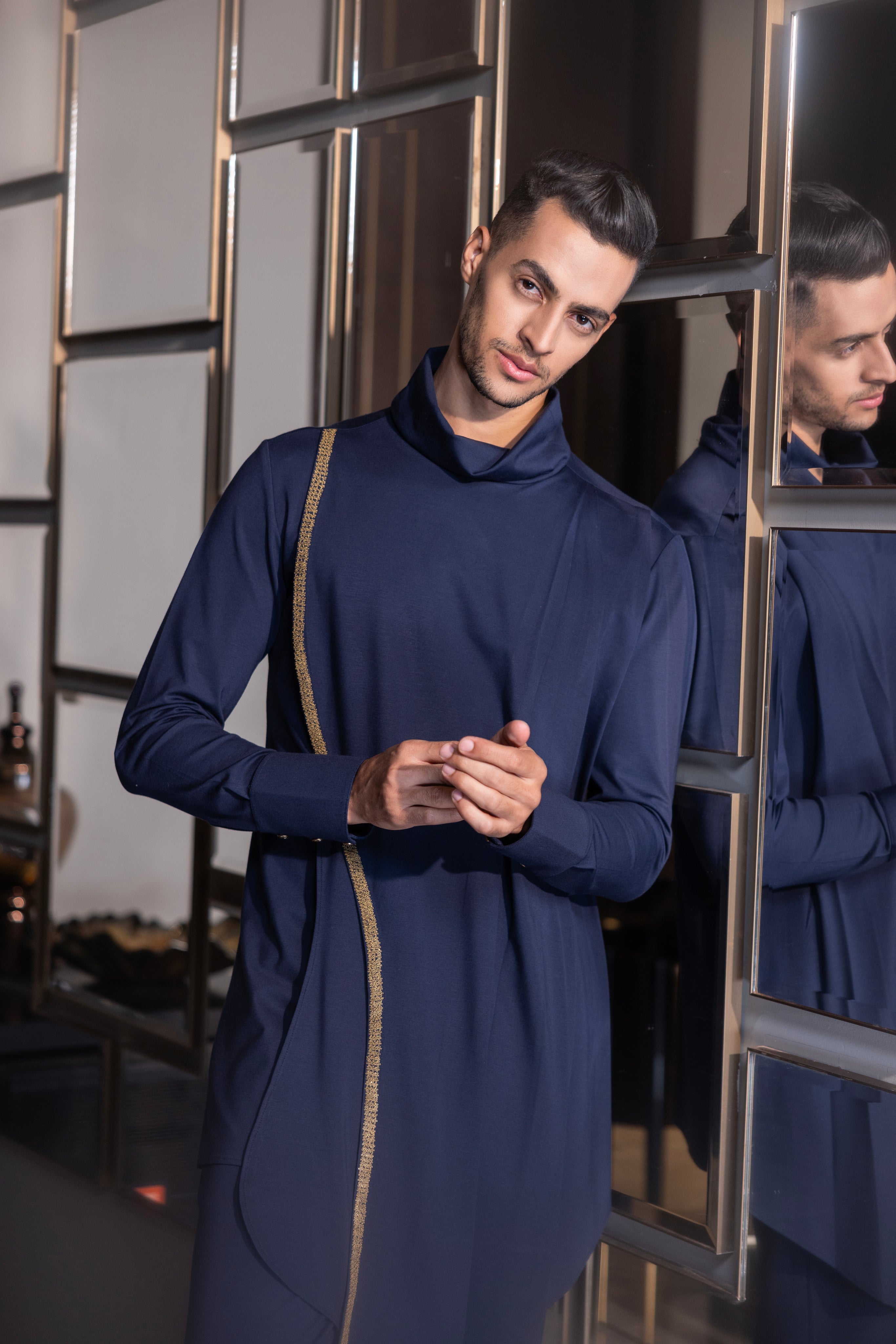 Navy Blue draped kurta with hand-embroidery detailing paired with a matching aligadhi set.