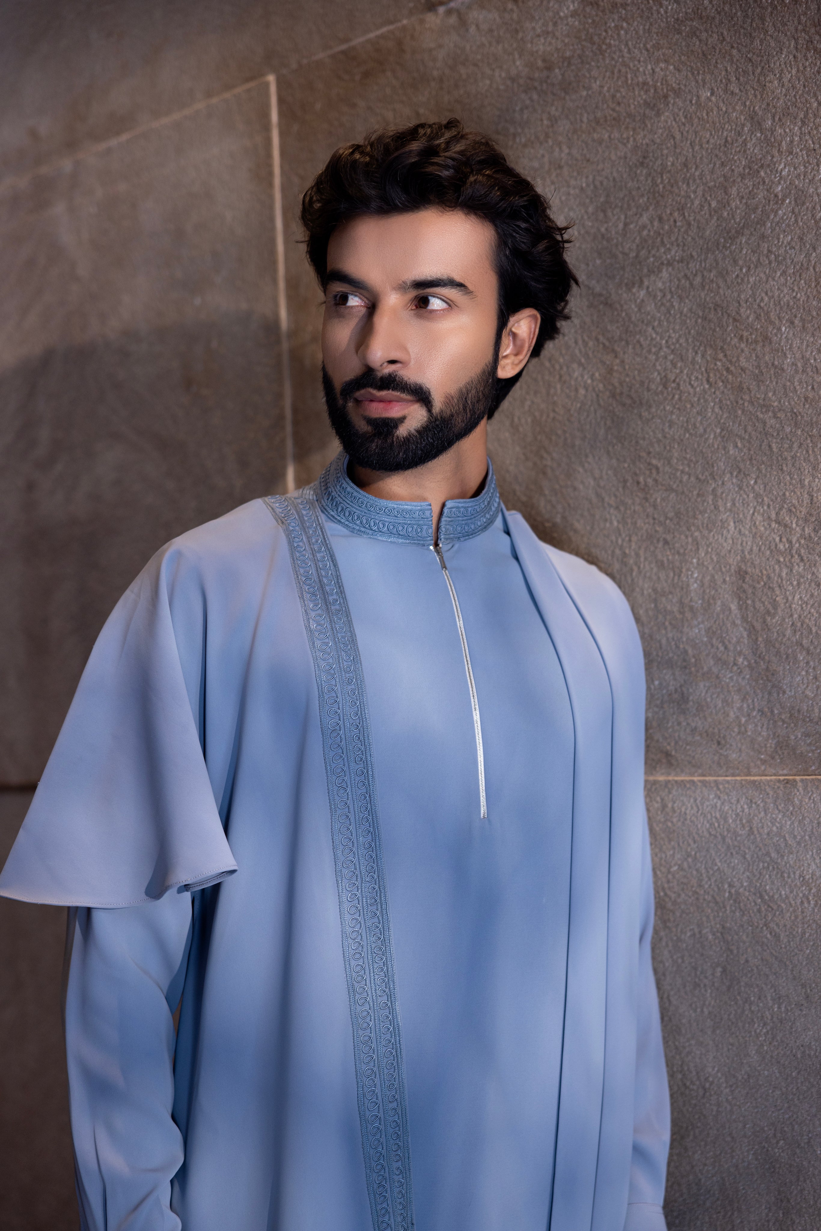 Sky blue hand-embroidered kurta with draping details paired with a matching aligadhi.