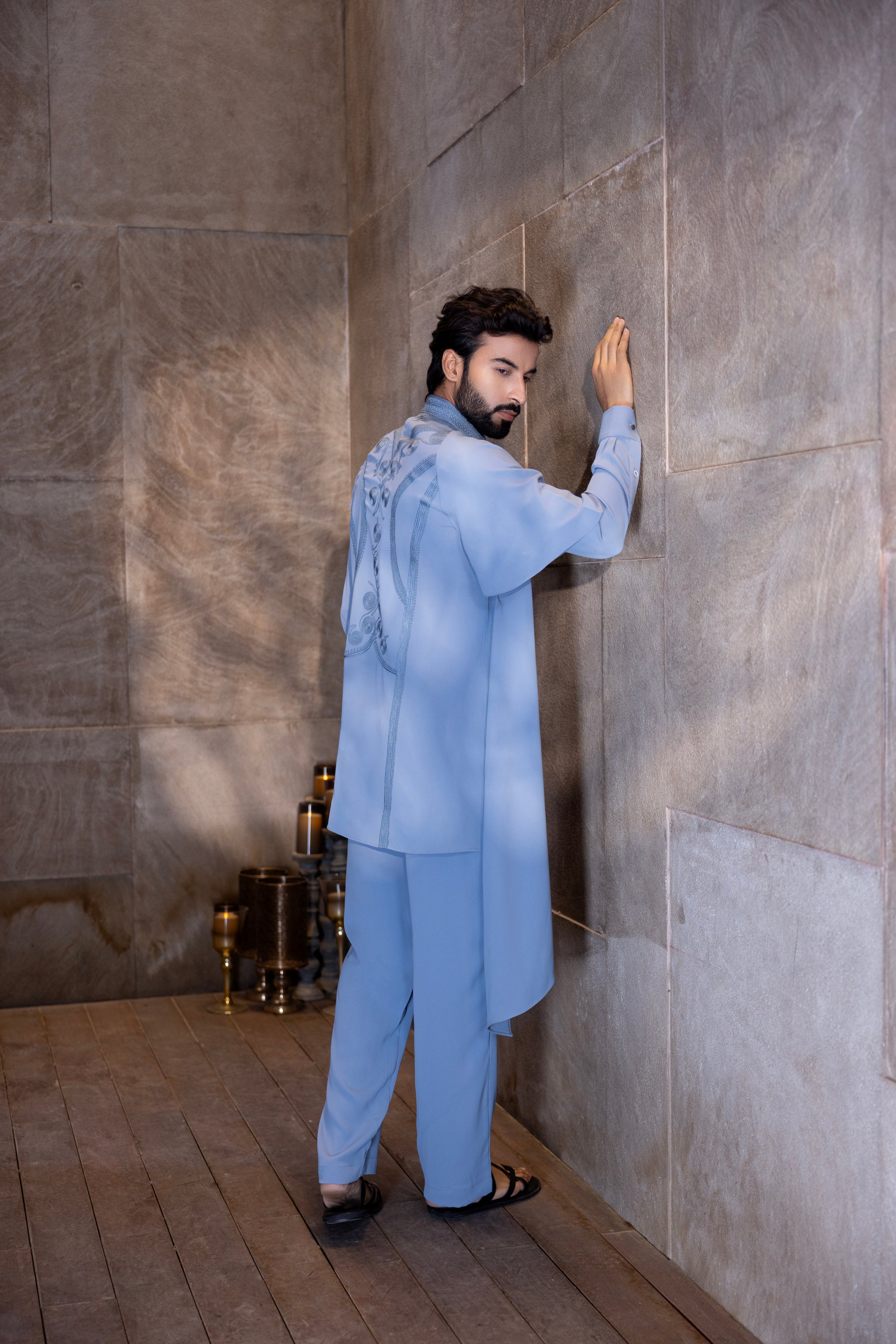 Sky blue hand-embroidered kurta with draping details paired with a matching aligadhi.