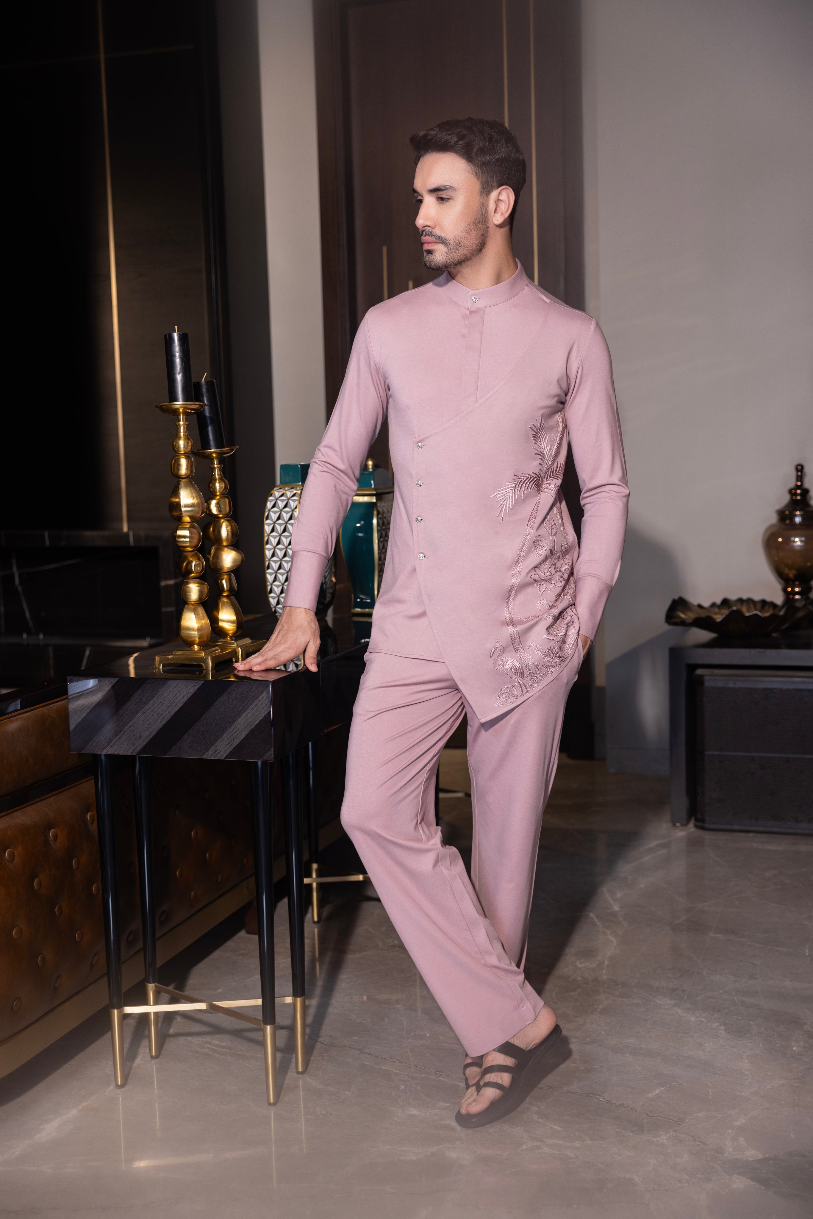 Pink hand-embroidered kurta with draping details paired with a matching aligadhi set.