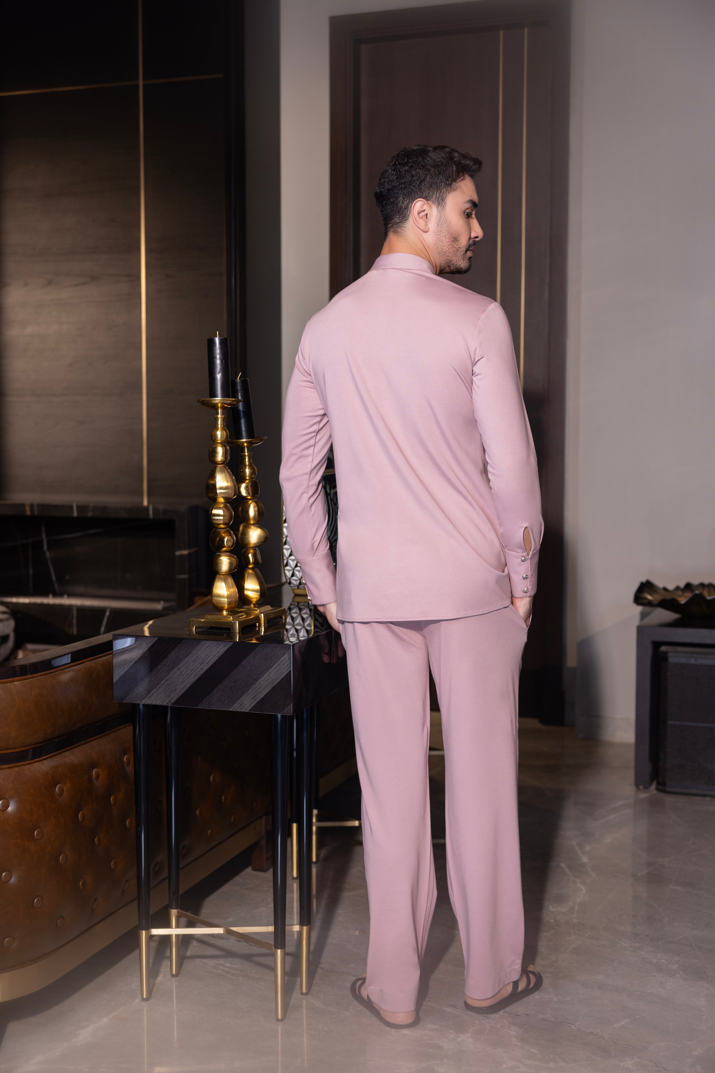 Pink hand-embroidered kurta with draping details paired with a matching aligadhi set.